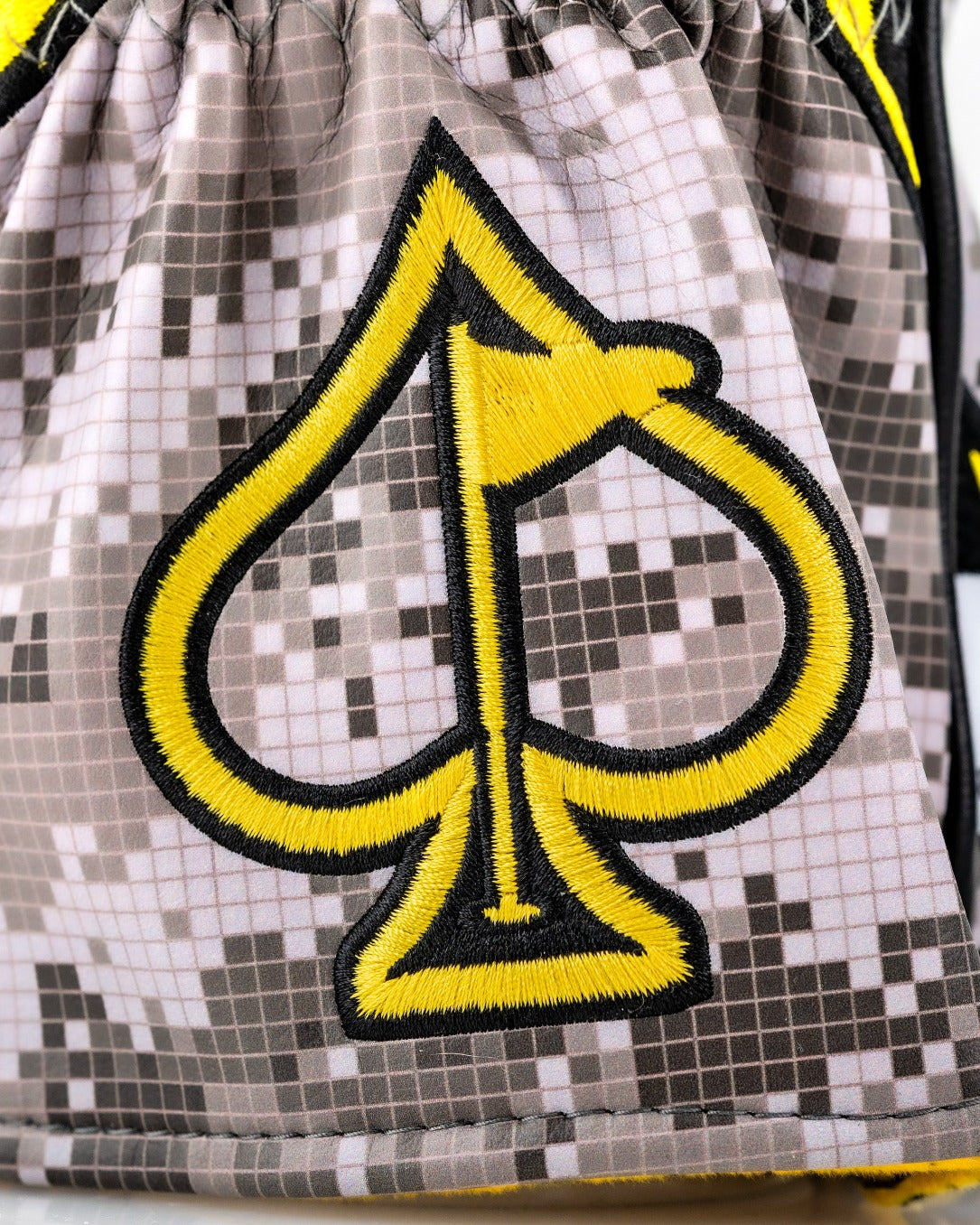 Bold Don't Tread On Me 2.0 driver cover featuring a striking spade logo in yellow on a gray digital camo background.