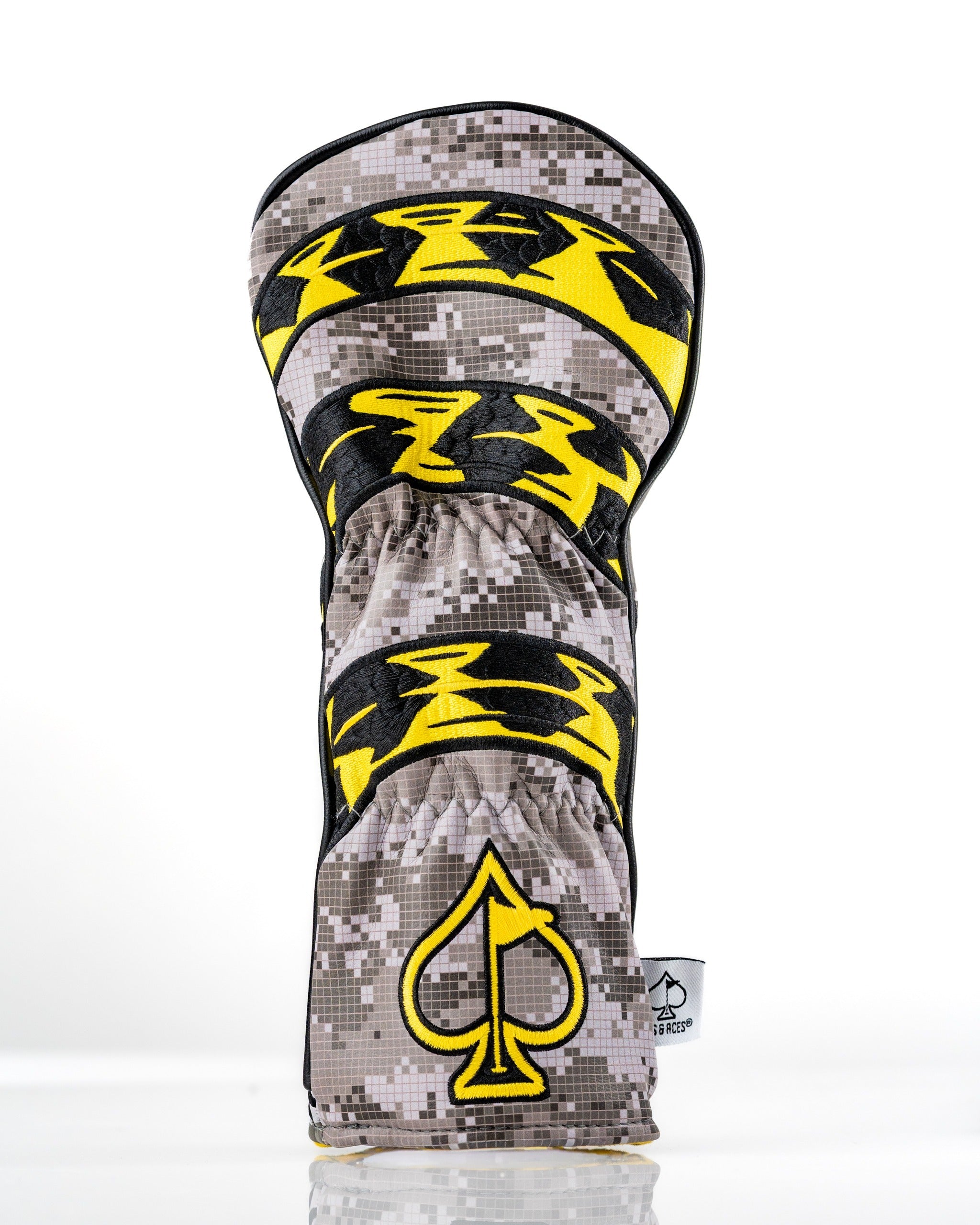 Camo fairway cover featuring bold yellow graphics and a spade logo, designed for golfers who want to stand out.