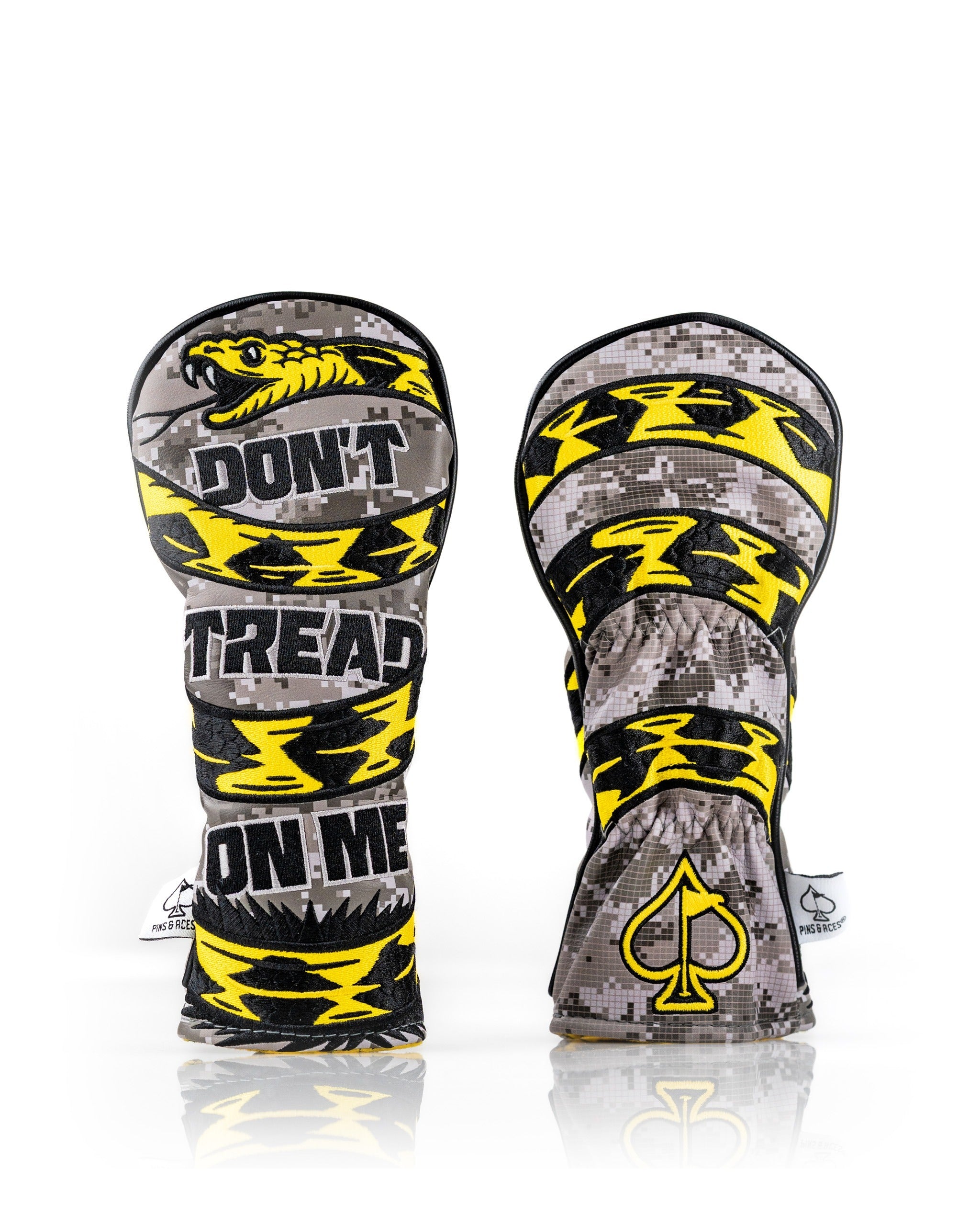 Bold Don't Tread On Me 2.0 hybrid golf cover featuring a striking yellow and black design with a camouflage pattern.