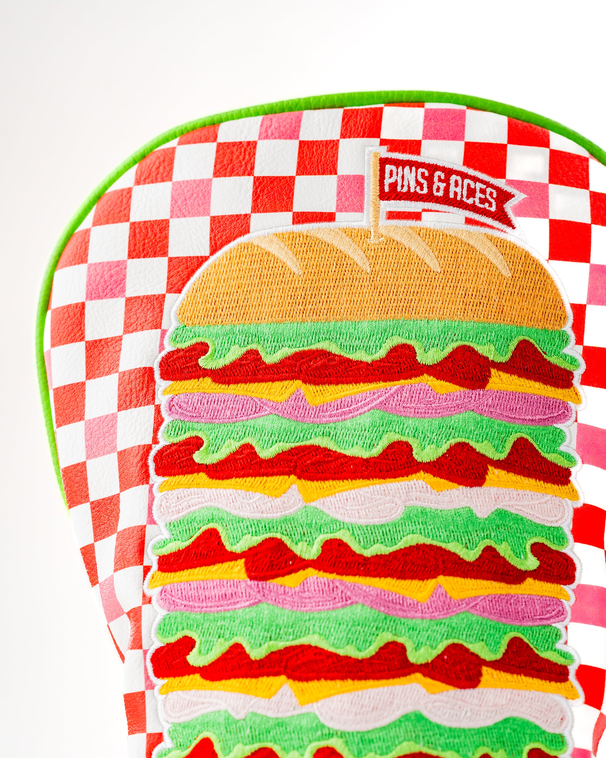 Bold driver cover featuring a colorful burger design with vibrant layers, perfect for golfers who want to stand out.