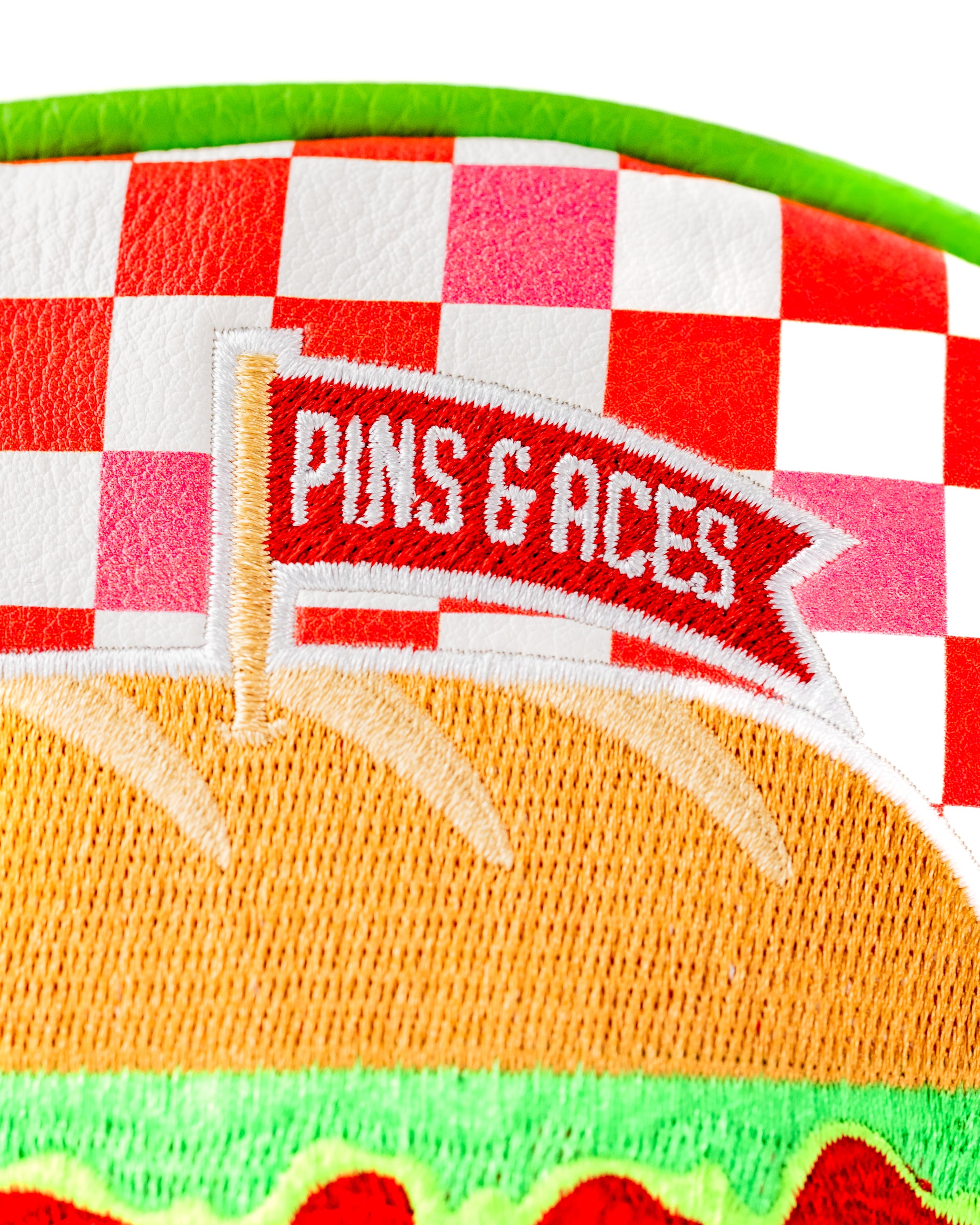 Bold driver cover featuring a colorful burger design and the Pins & Aces logo, perfect for golfers who want to stand out.