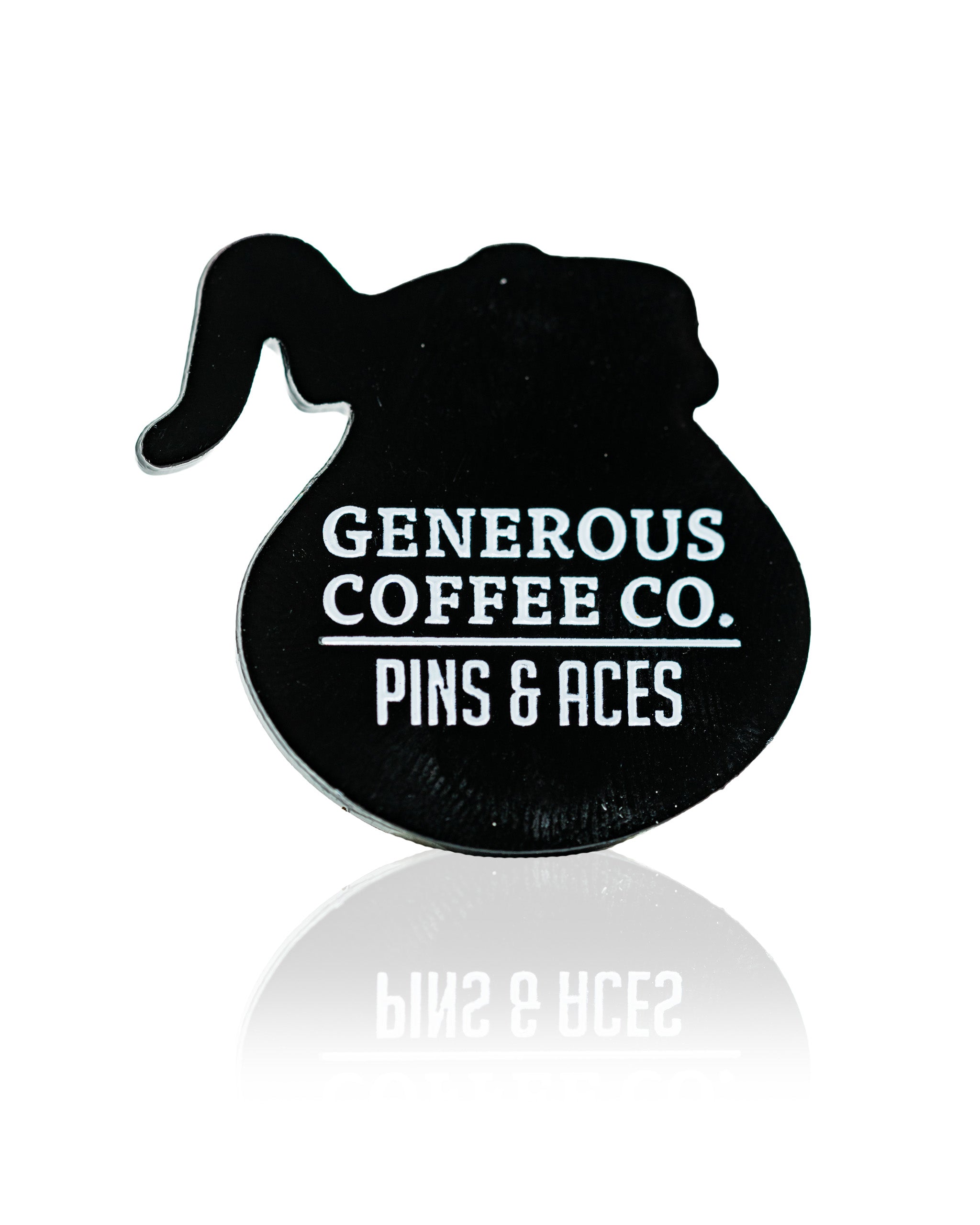 Black coffee pot-shaped ball marker featuring the Generous Coffee Co. and Pins & Aces logos for golfers.