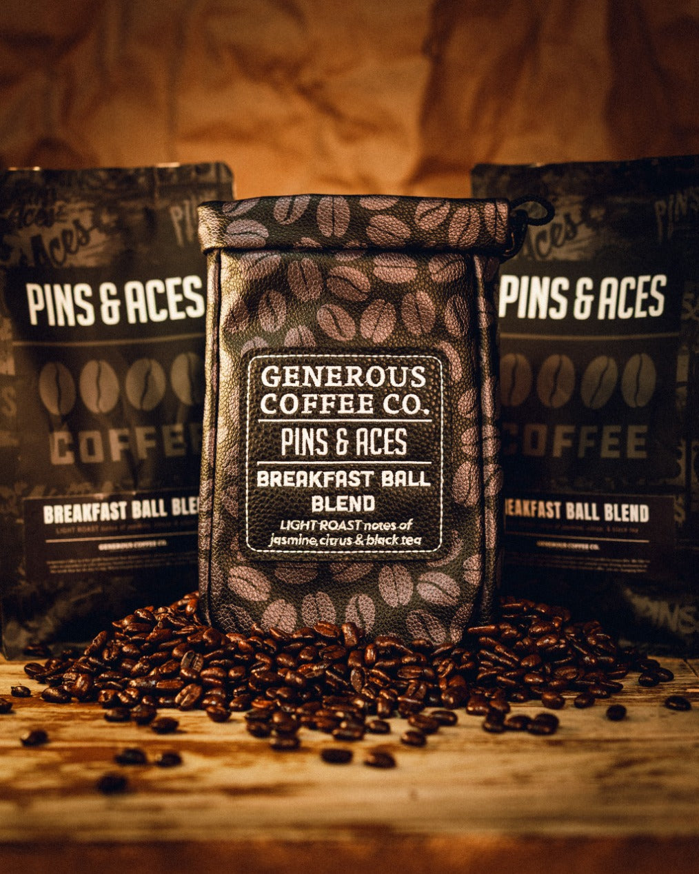 Generous Coffee valuables pouch surrounded by coffee bags and scattered coffee beans, showcasing a stylish design.