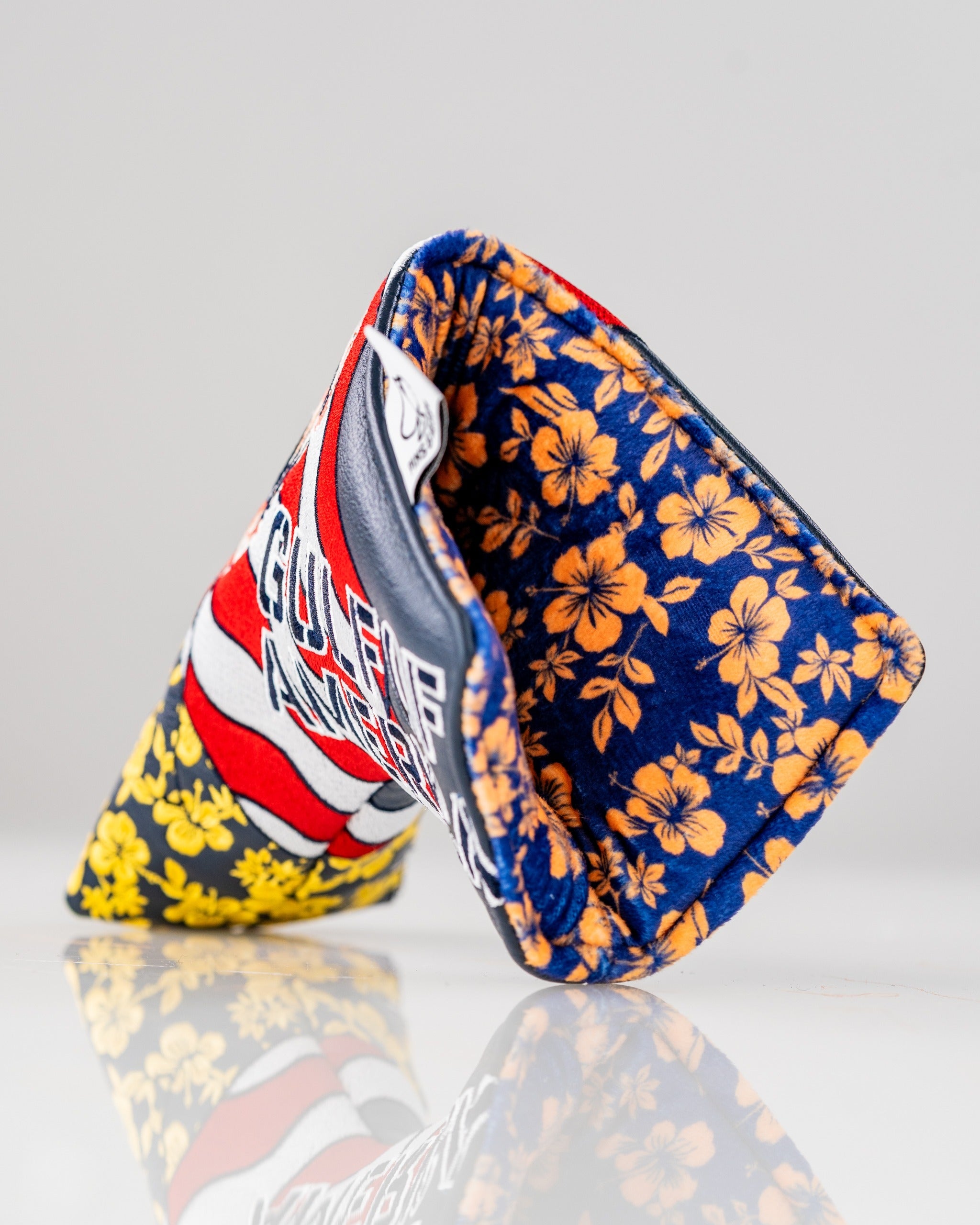 Bold golf blade cover featuring a vibrant floral pattern and patriotic design, perfect for golfers who want to stand out.