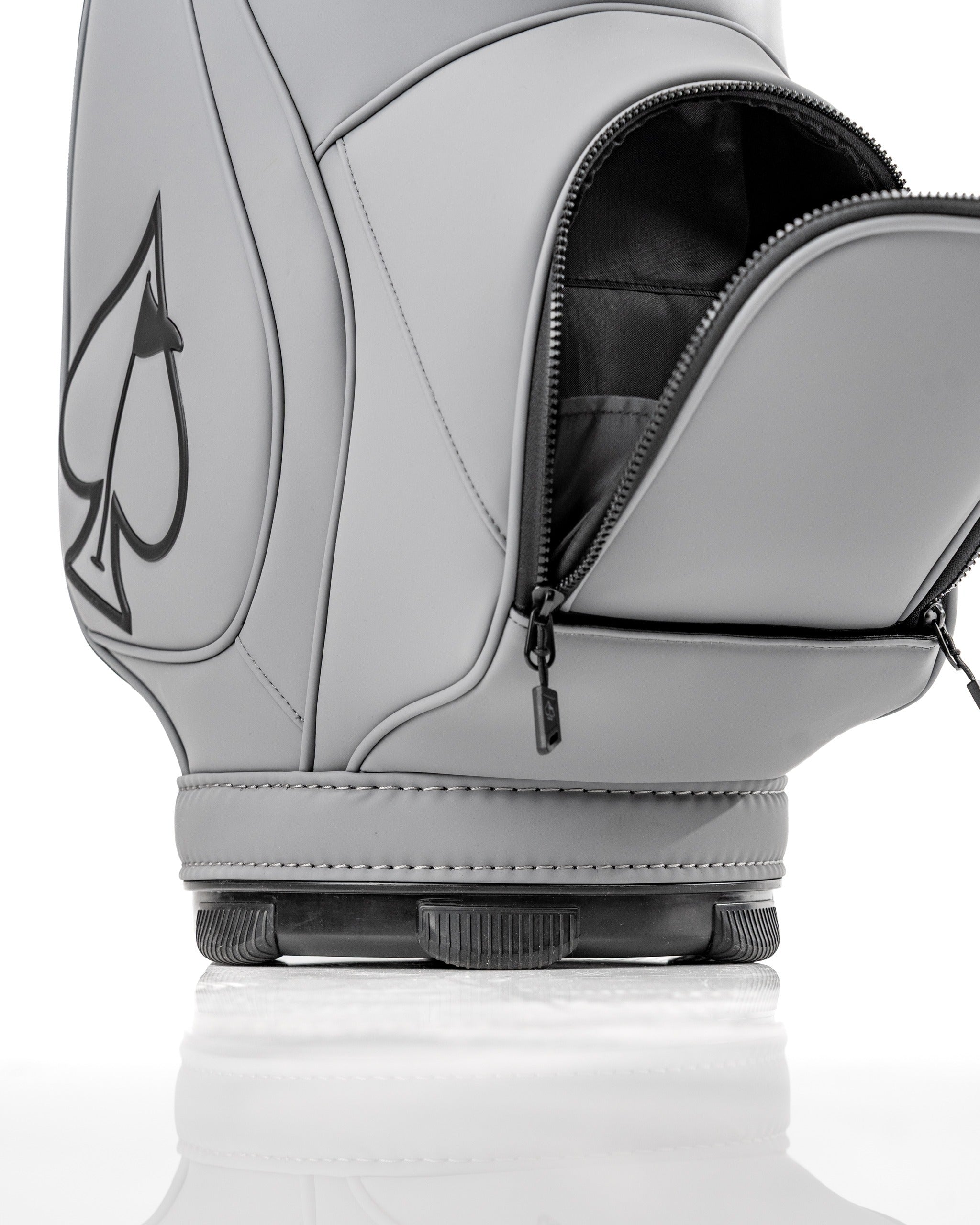 Stylish gray Den Caddy with a sleek design, featuring a zippered pocket and bold spade logo for golf enthusiasts.