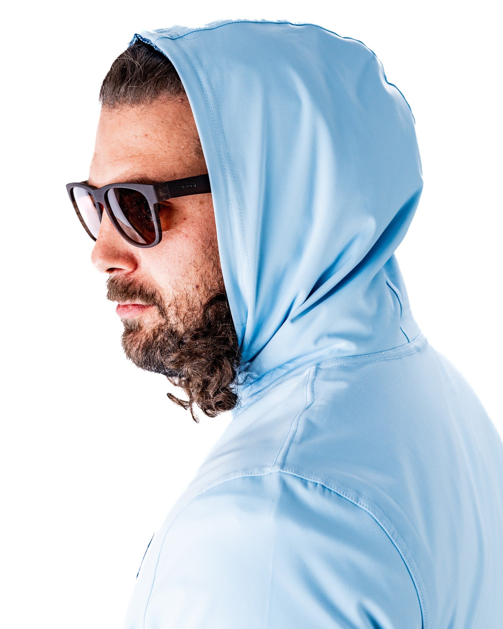 Performance Golf Hoodie in Squiggle Blue, featuring a sleek design and a hood, worn by a man with sunglasses.