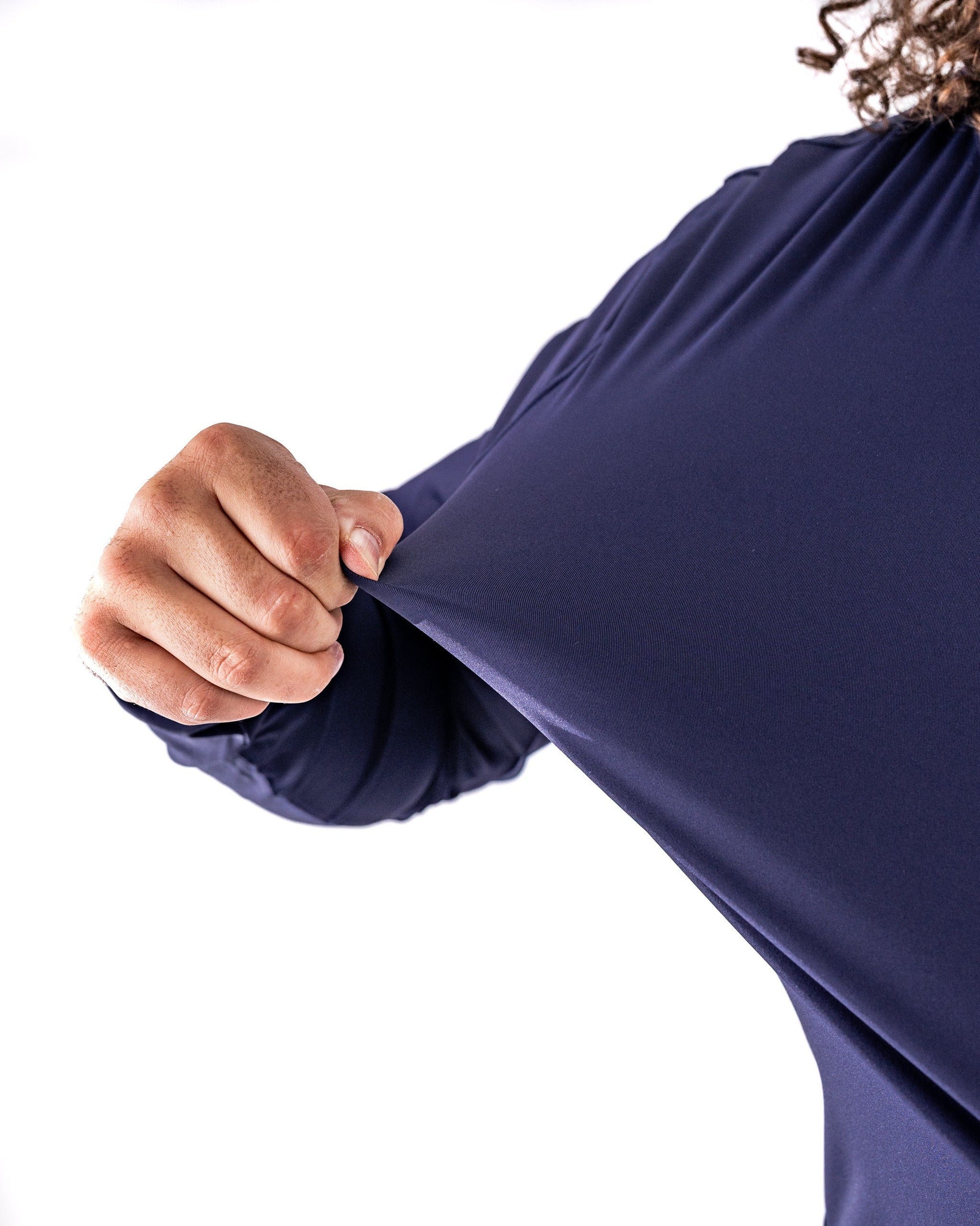 Performance Golf Hoodie in Lavender Flower Power, showcasing a close-up of the fabric being stretched for flexibility.