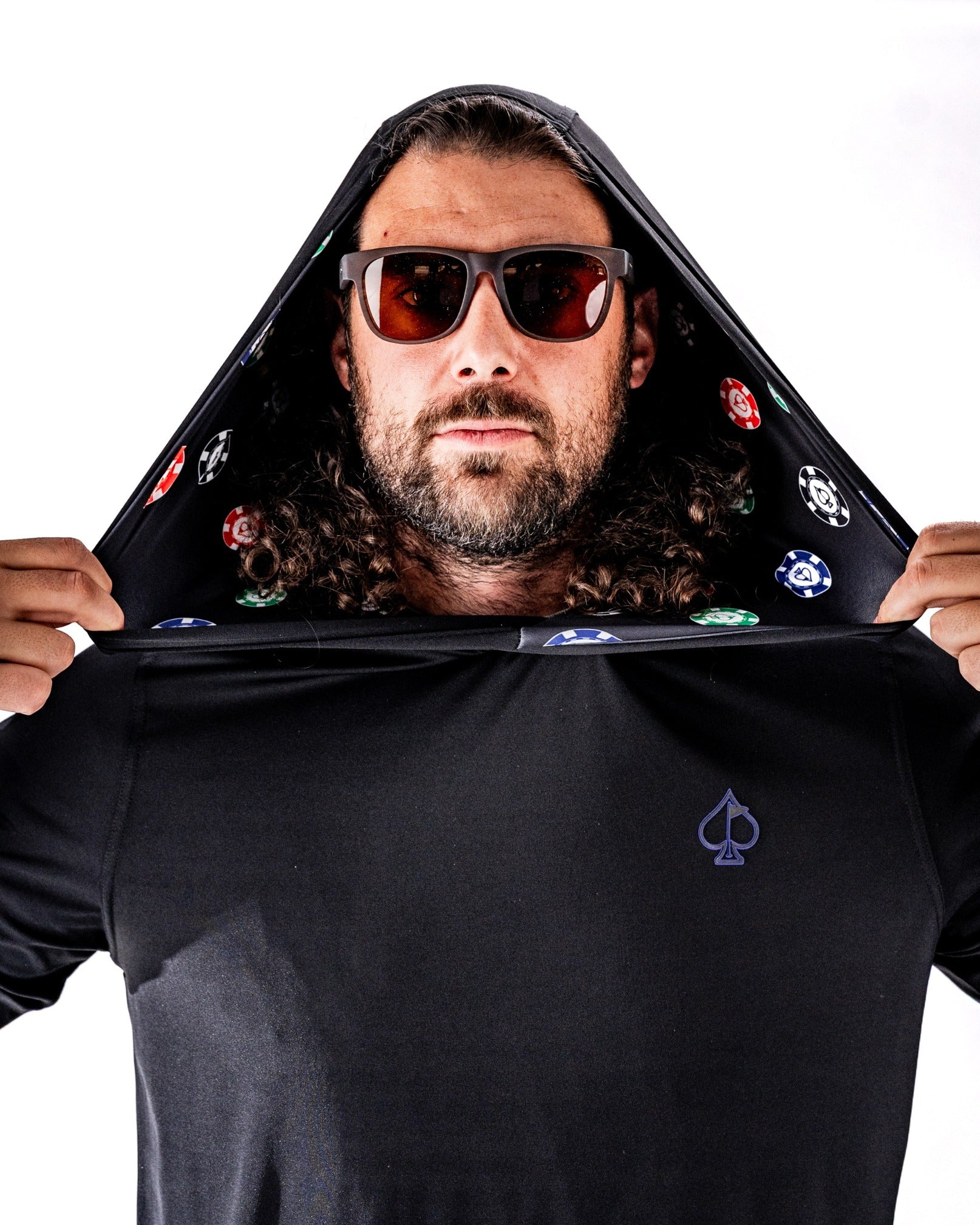 Performance golf hoodie featuring a poker theme, with a player wearing sunglasses and a hood lined with poker chips.