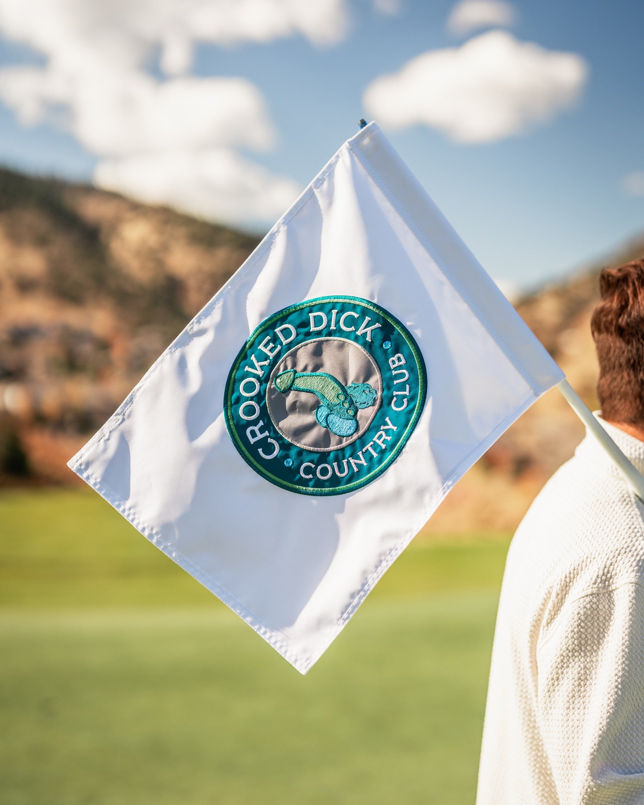 Golf flag featuring the Crooked Dick Club logo, designed for a fun and bold golfing experience on the course.