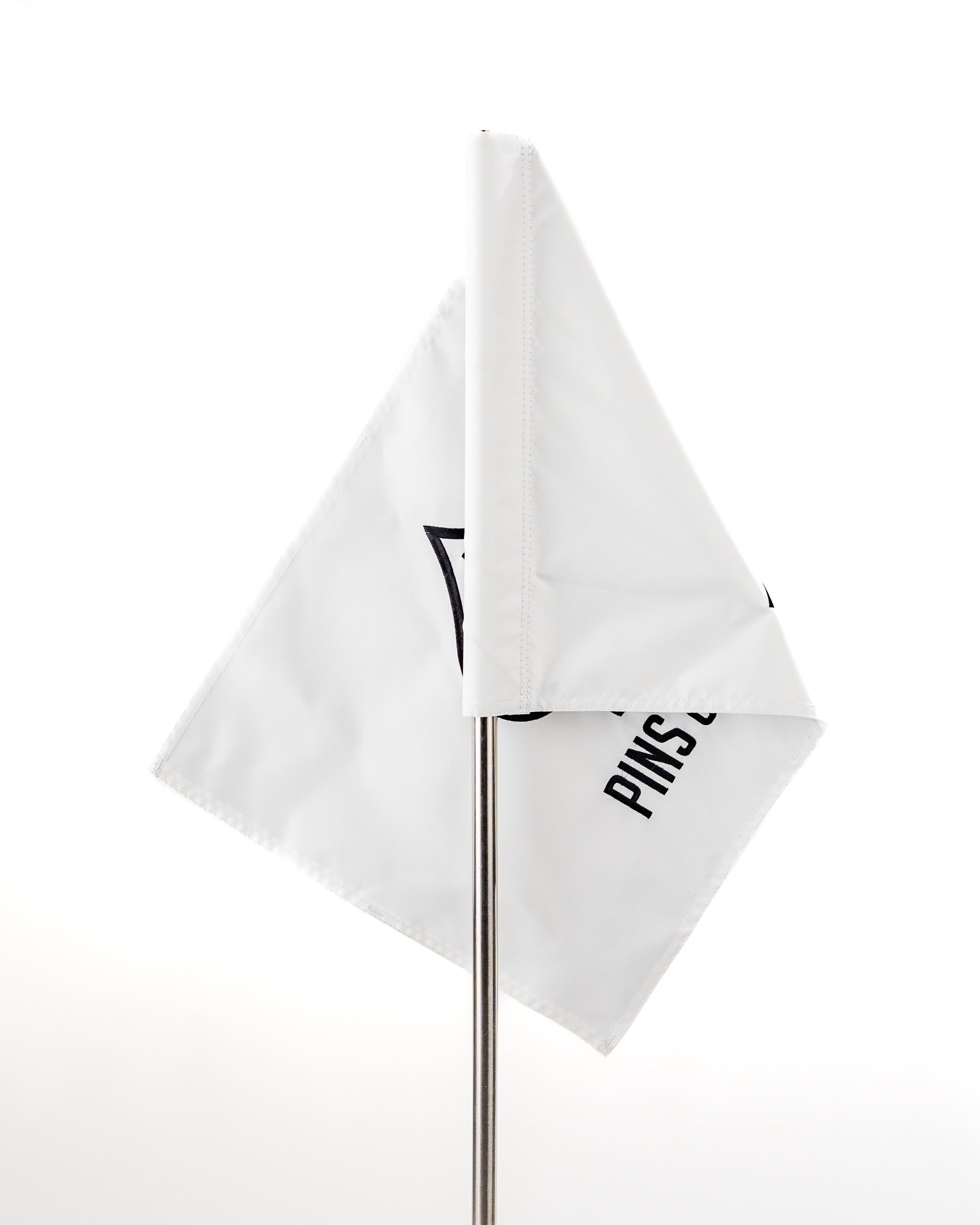 White golf flag featuring the Pins and Aces logo, designed for golfers seeking stylish course accessories.