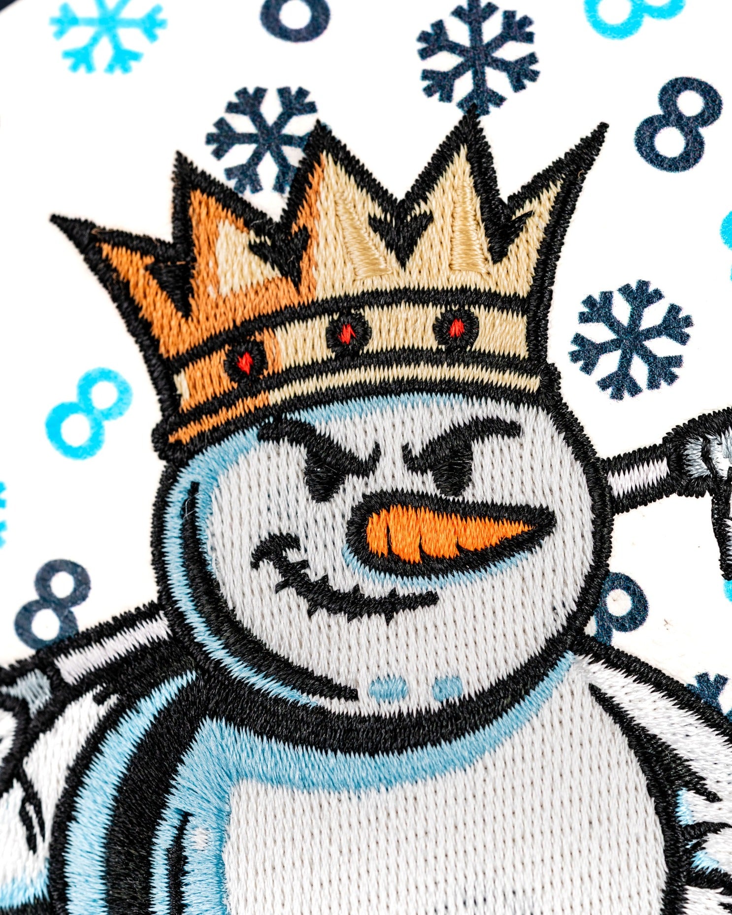Snowman hybrid golf cover featuring a crowned snowman design with a mischievous expression and snowflake patterns.