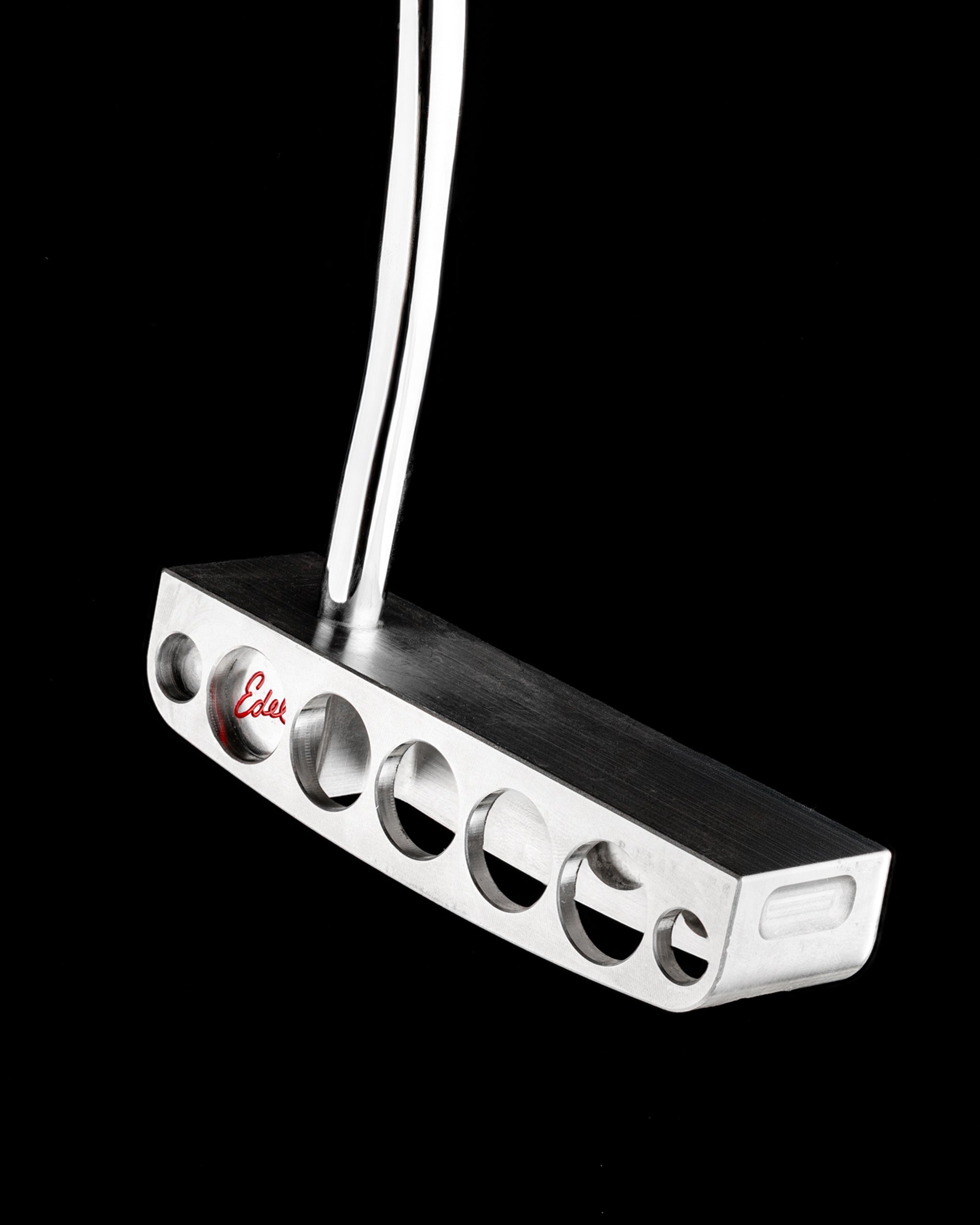 Sleek Edel Golf Blade Putter with a polished finish and distinctive cutouts for enhanced performance on the green.