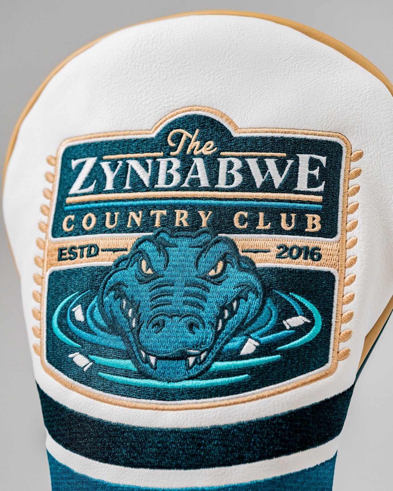 Bold driver cover featuring the Zynbabwe Country Club logo with an alligator design, perfect for standout golf style.