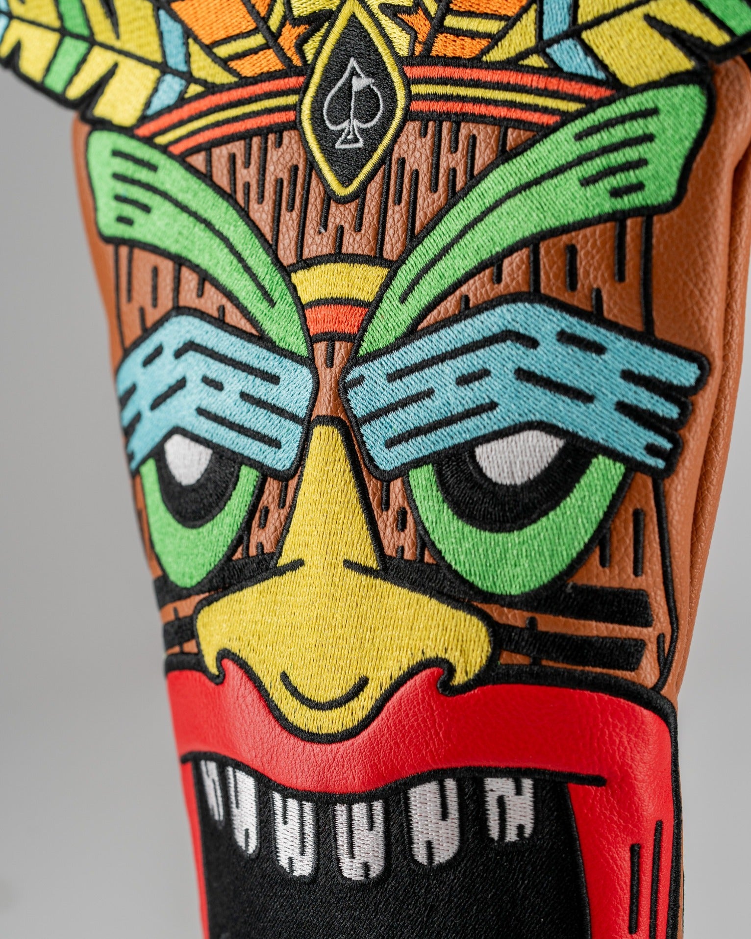 Colorful Tiki driver cover featuring a vibrant design with a fierce face and intricate patterns, perfect for bold golfers.