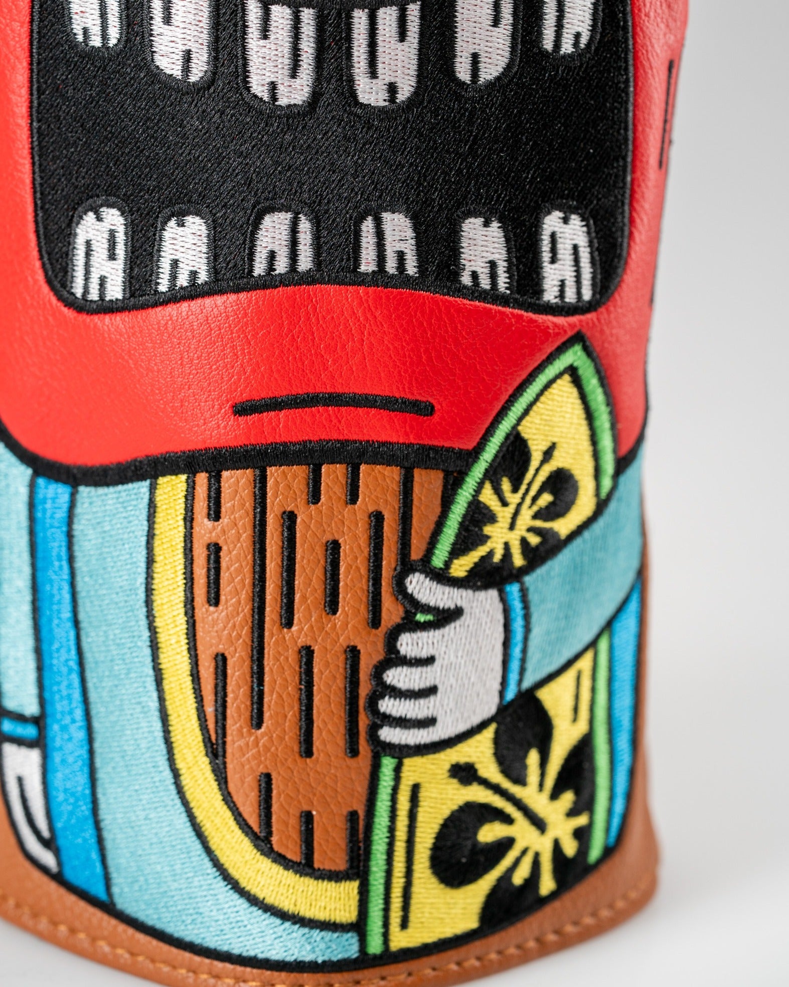 Colorful Tiki driver cover featuring intricate designs and vibrant colors, perfect for adding flair to your golf bag.