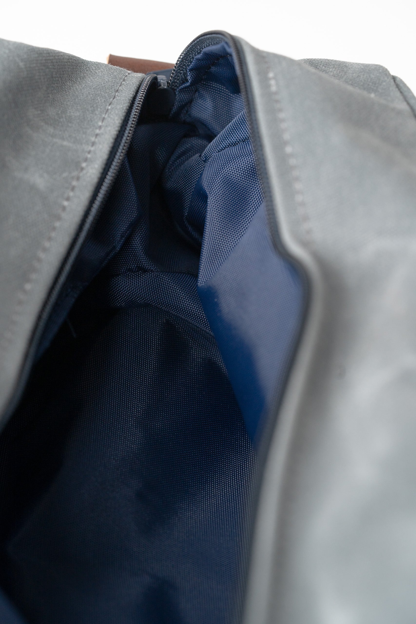 Spacious black toiletry bag with a navy interior, featuring a smooth zipper for easy access to essentials.