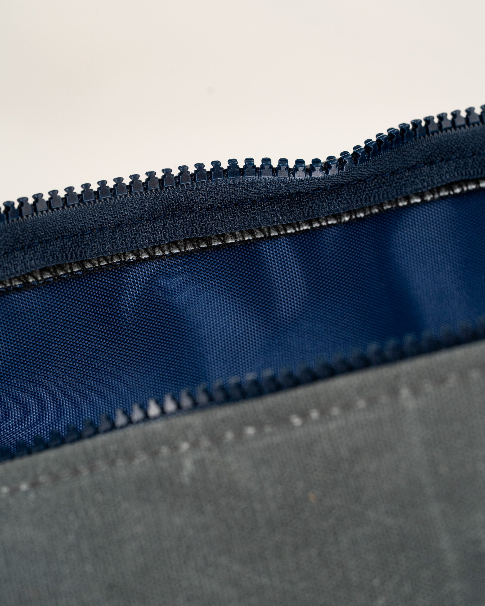 Close-up of the zipper on a Black Friday duffel bag, showcasing the durable fabric and interior lining.