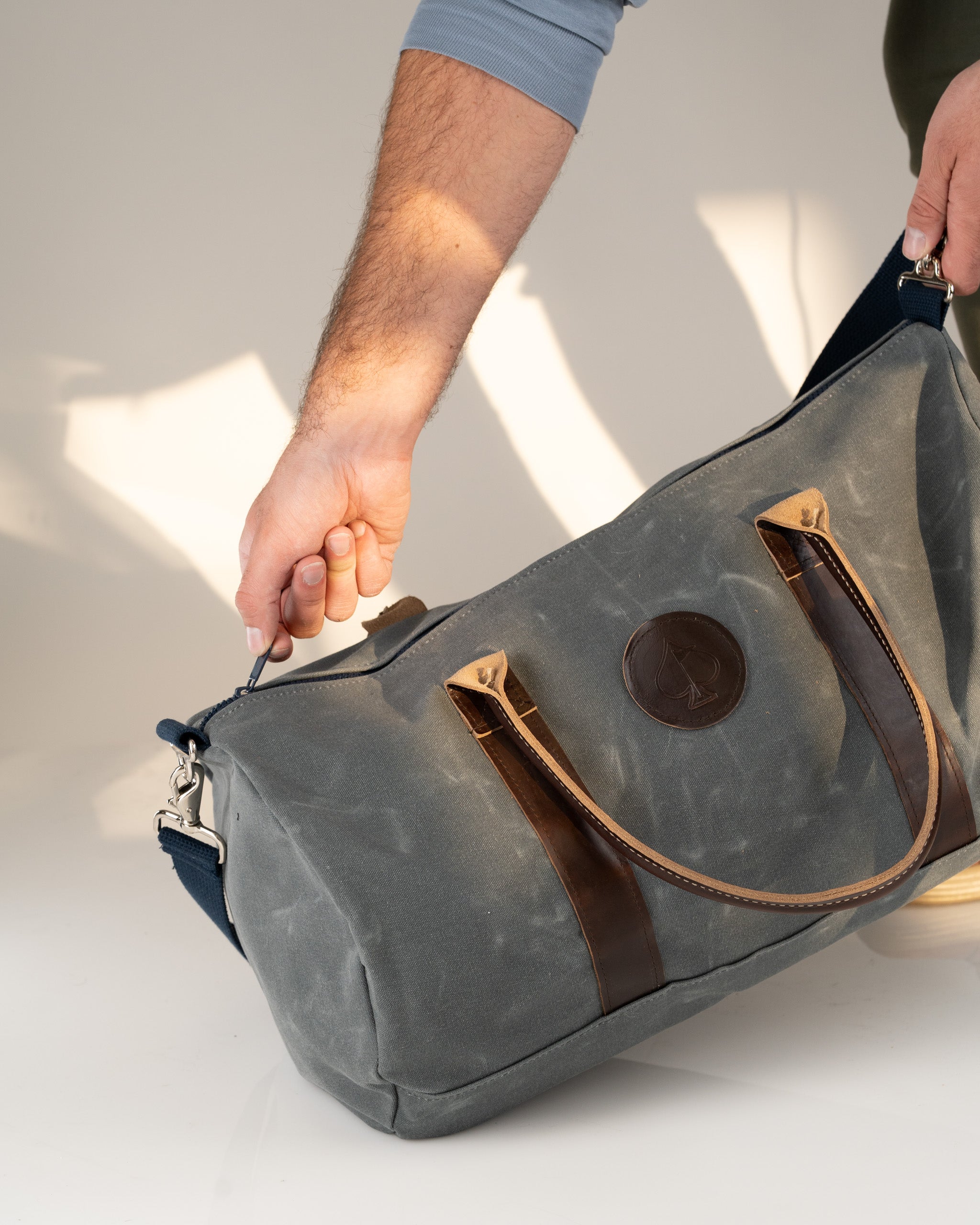 Stylish Black Friday duffel bag with leather accents, perfect for golf gear and accessories. Durable and functional design.