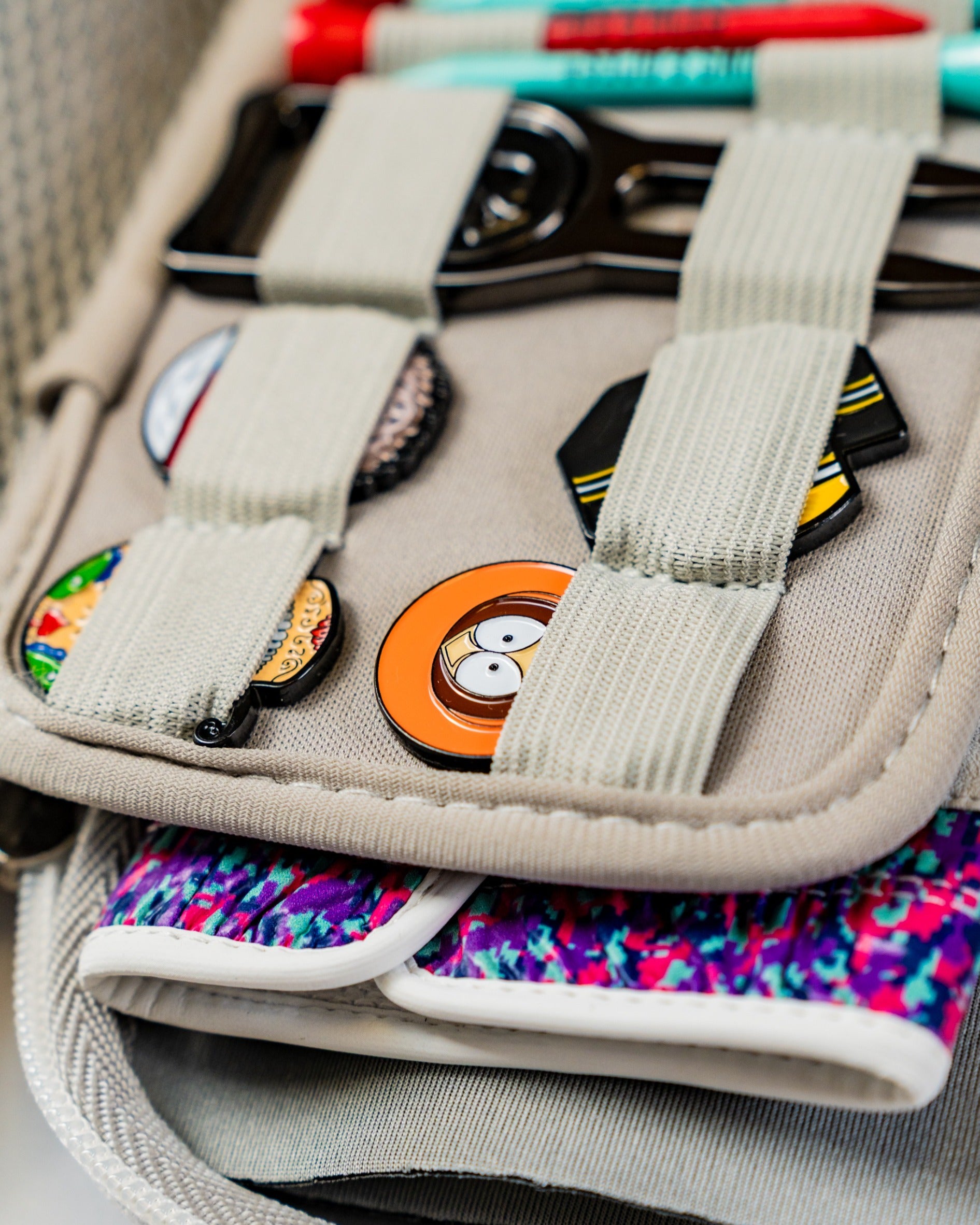 Gray glove and accessory caddie featuring organized compartments for golf gloves and small accessories.
