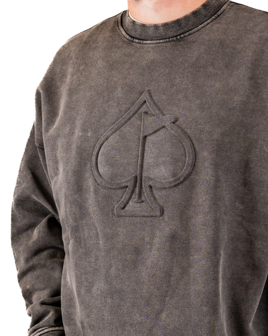 Washed iron crewneck sweatshirt featuring an embossed spade logo, designed for a stylish and bold golf look.