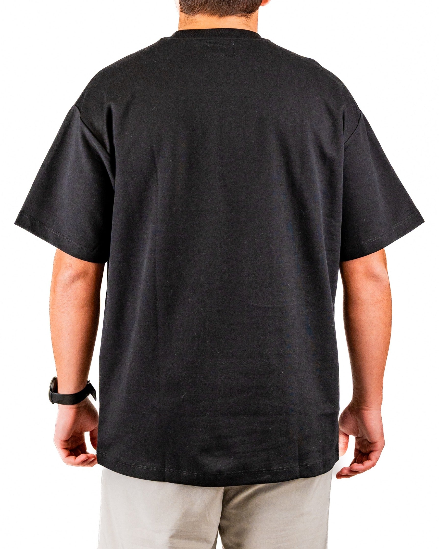 Men's black embossed spade tee shirt featuring a relaxed fit and short sleeves, ideal for stylish golf outings.