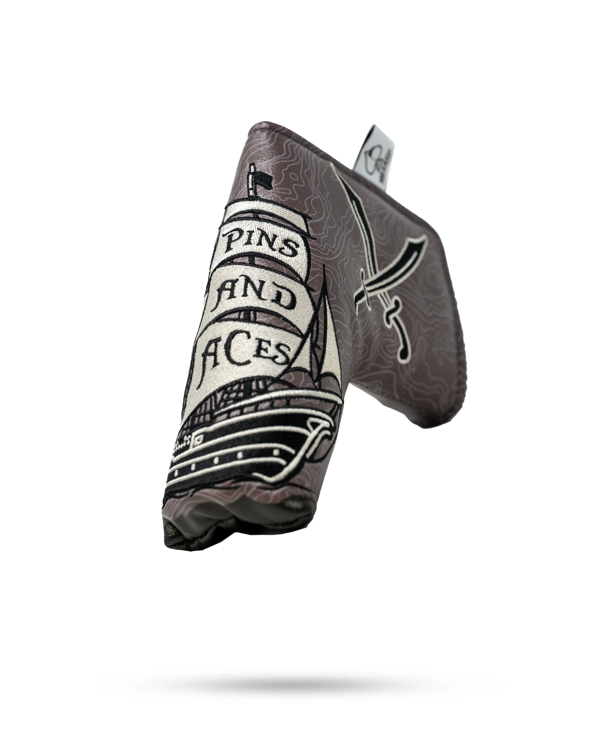 Alt text: Black leather pirate-themed blade putter cover featuring skull and crossbones design.