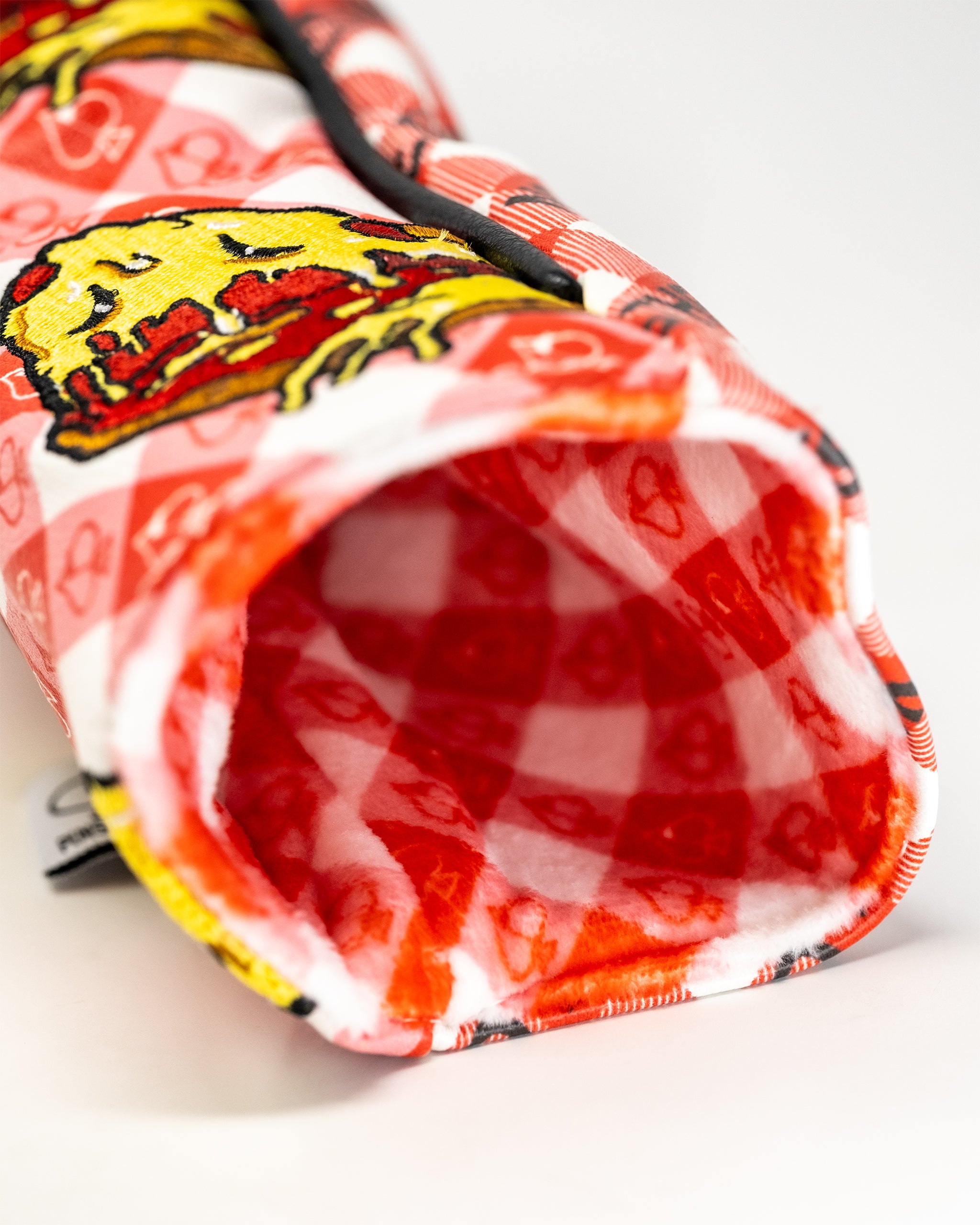 Colorful, bold golf headcover featuring a yellow cartoon character, red accents, and a checkered interior for standout style.