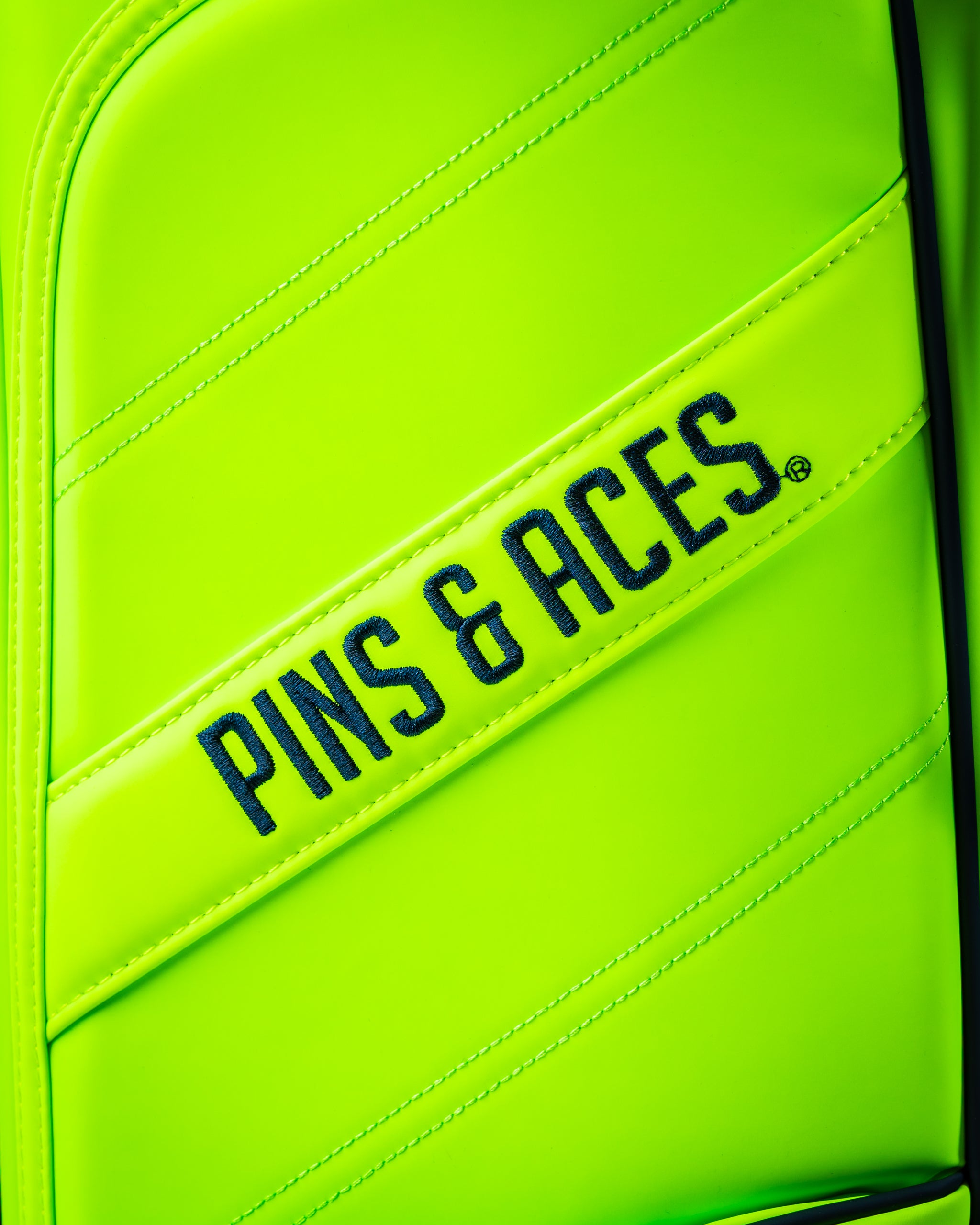 Bright electric tide golf bag featuring bold "Pins & Aces" branding, designed for golfers who want to stand out.