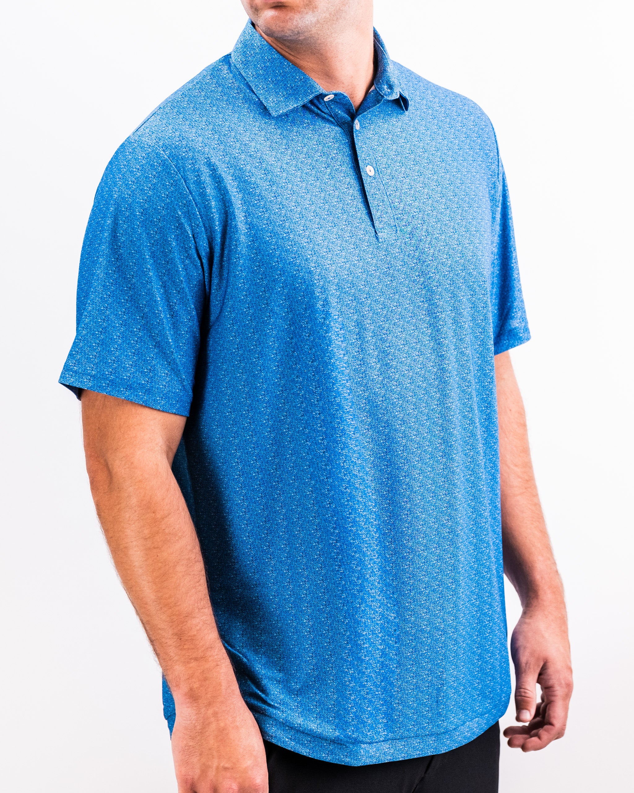 Bold blue golf polo with a speckled pattern, classic collar, and short sleeves for standout course style.