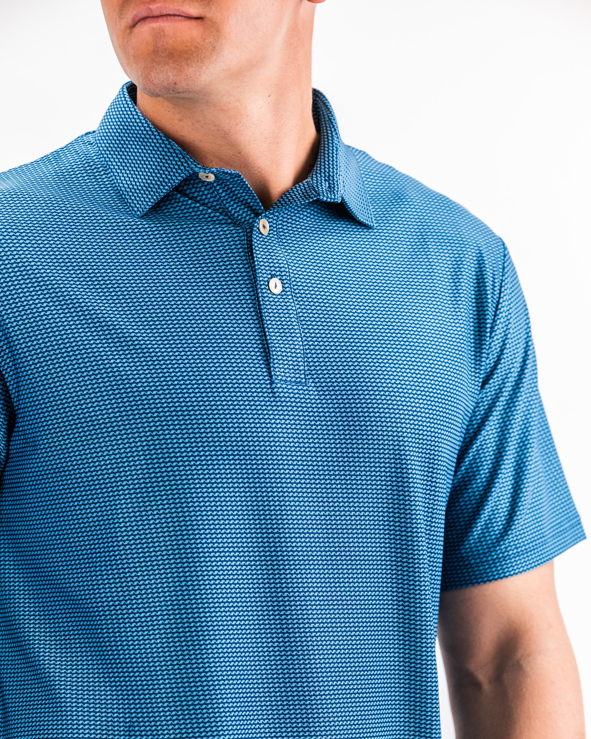 Player Preferred™ Polo in Ocean Wave color, featuring a sleek design, short sleeves, and a classic collar.