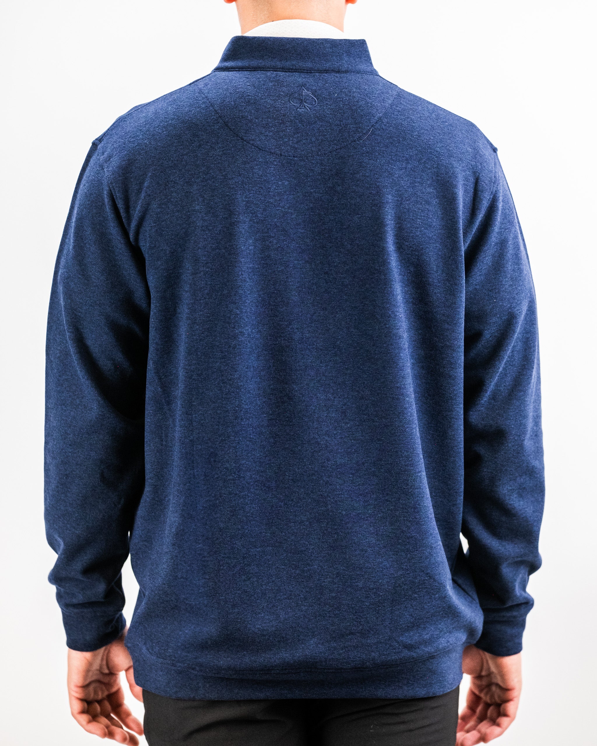 Back view of a person wearing a Heathered Navy Player Preferred™ Pullover with a collar and subtle embroidered logo on the upper back.