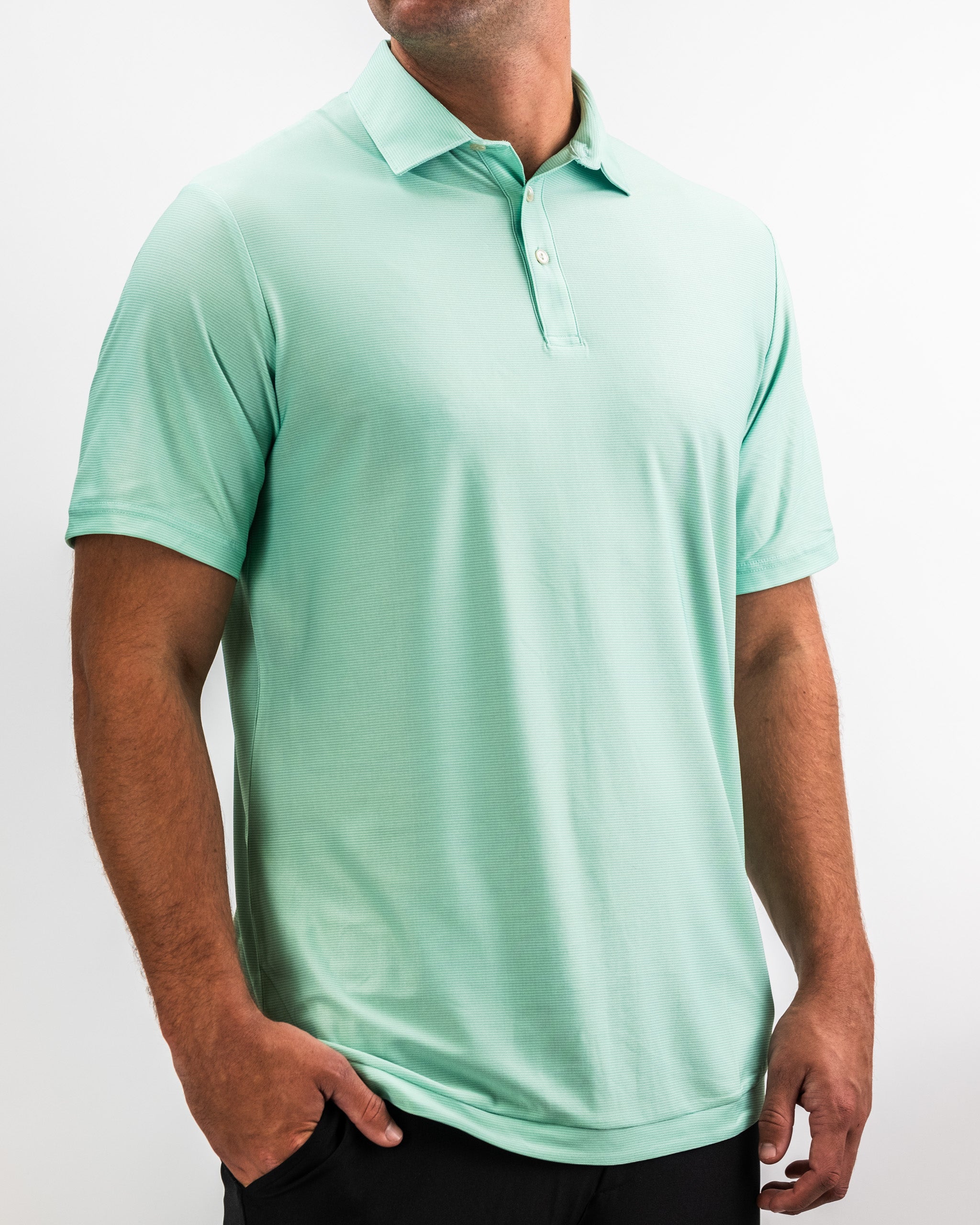 Bright mint green golf polo with subtle textured fabric, classic collar, and button placket, designed for bold golf style.