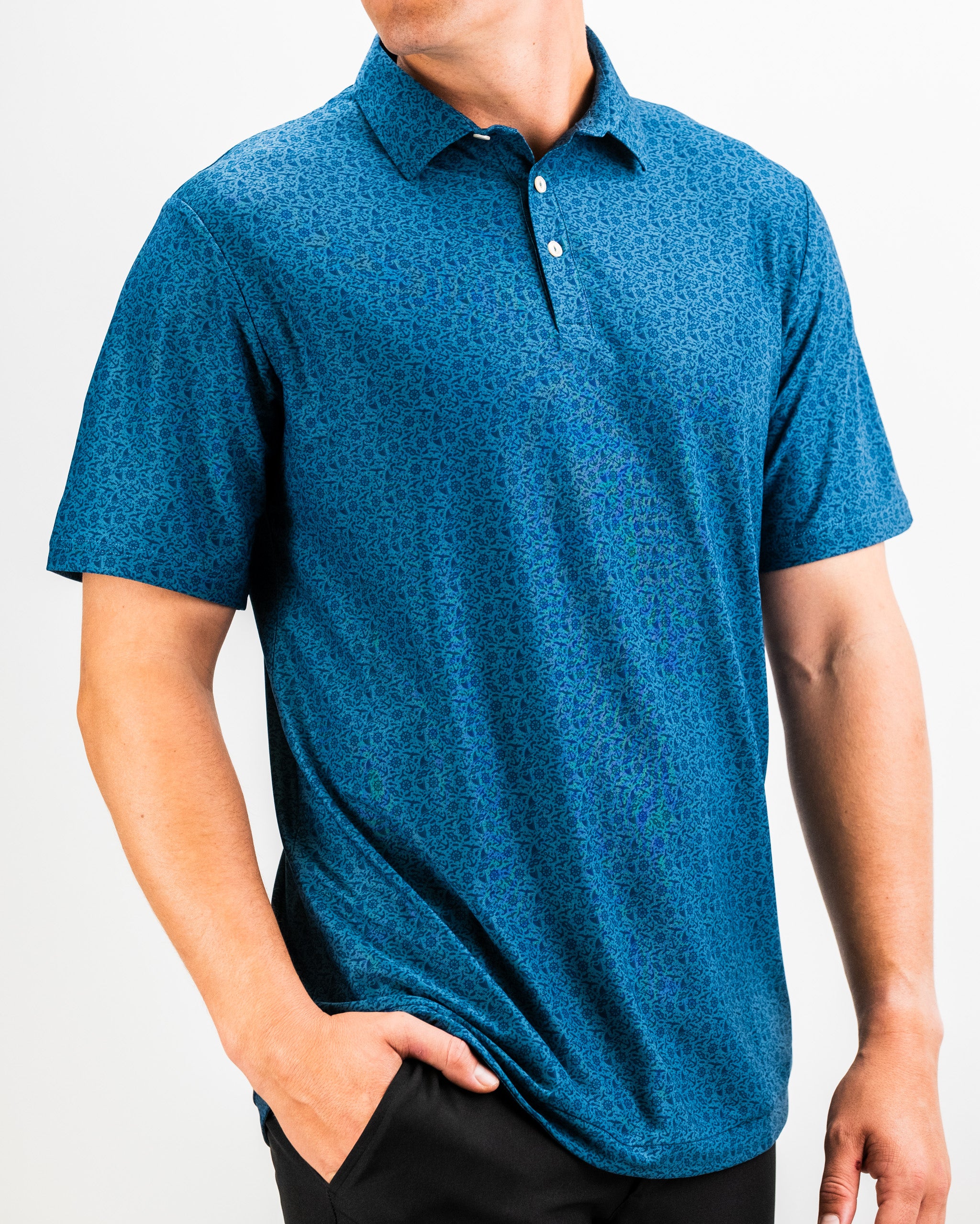 Bold blue patterned golf polo shirt with a collar, short sleeves, and white buttons, perfect for standing out on the course.