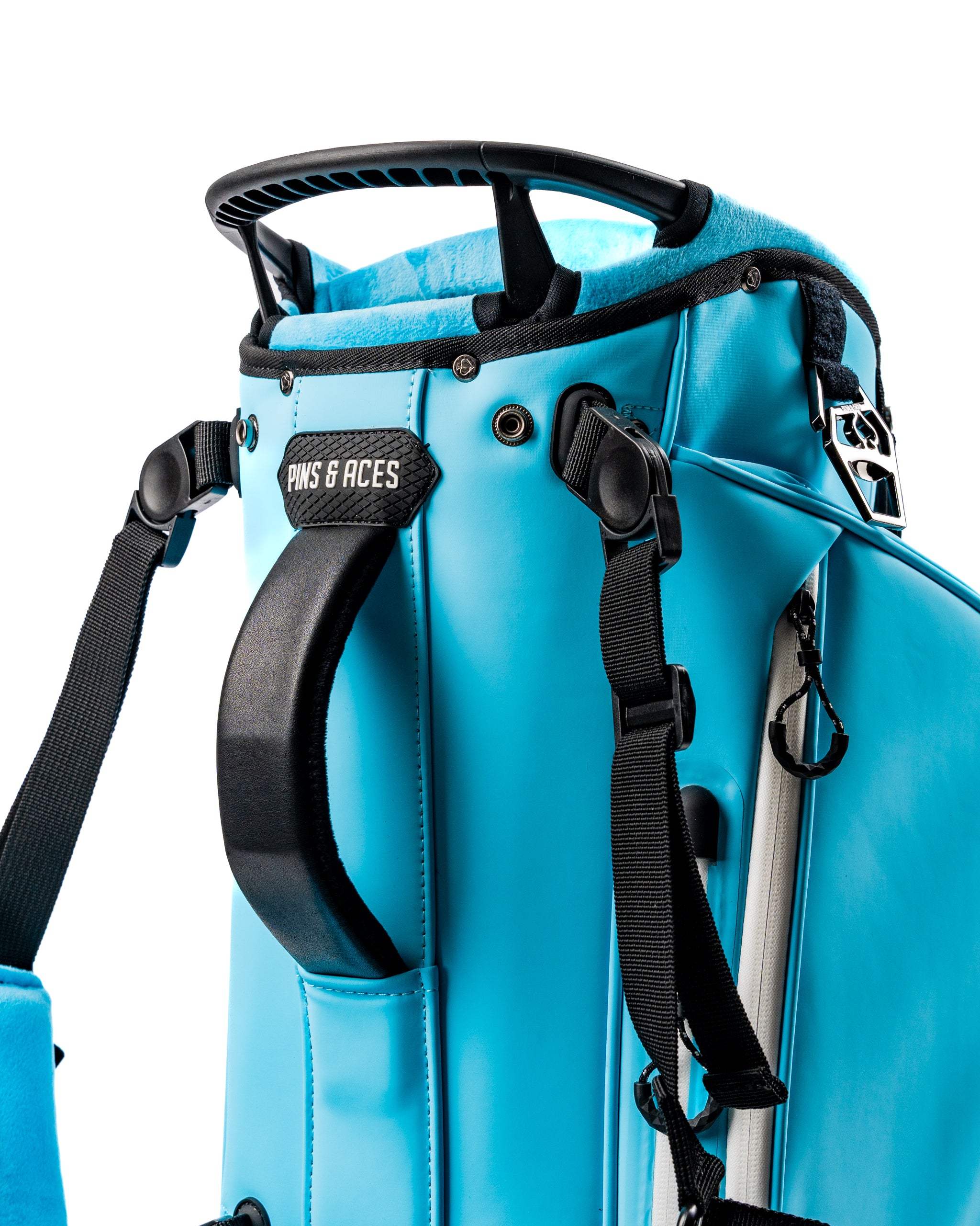 Close-up of the Player Preferred Golf Bag in Glacier, showcasing its vibrant blue color and sturdy handle.