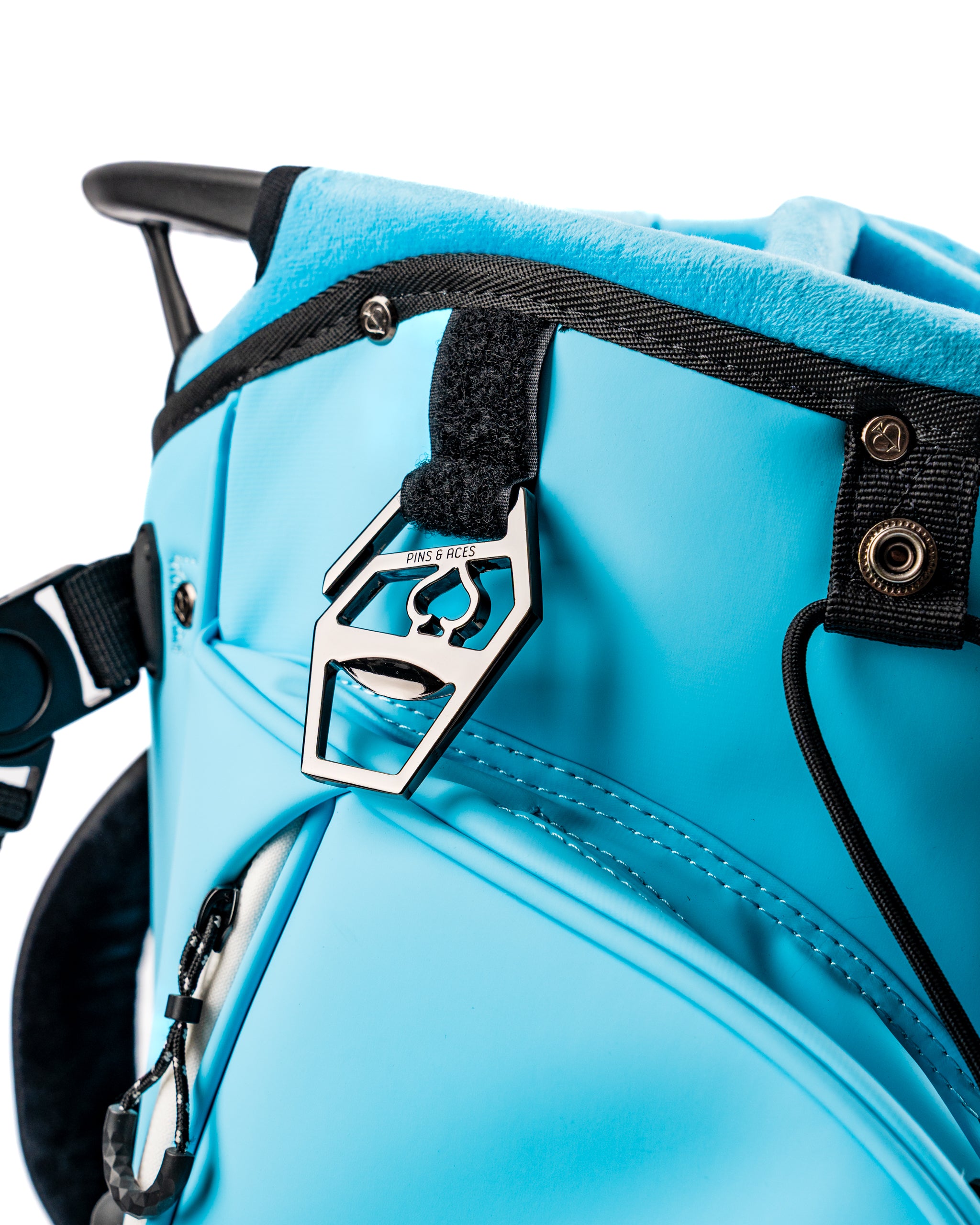 Close-up of the Player Preferred Golf Bag in Glacier, featuring a vibrant blue exterior and a stylish logo tag.