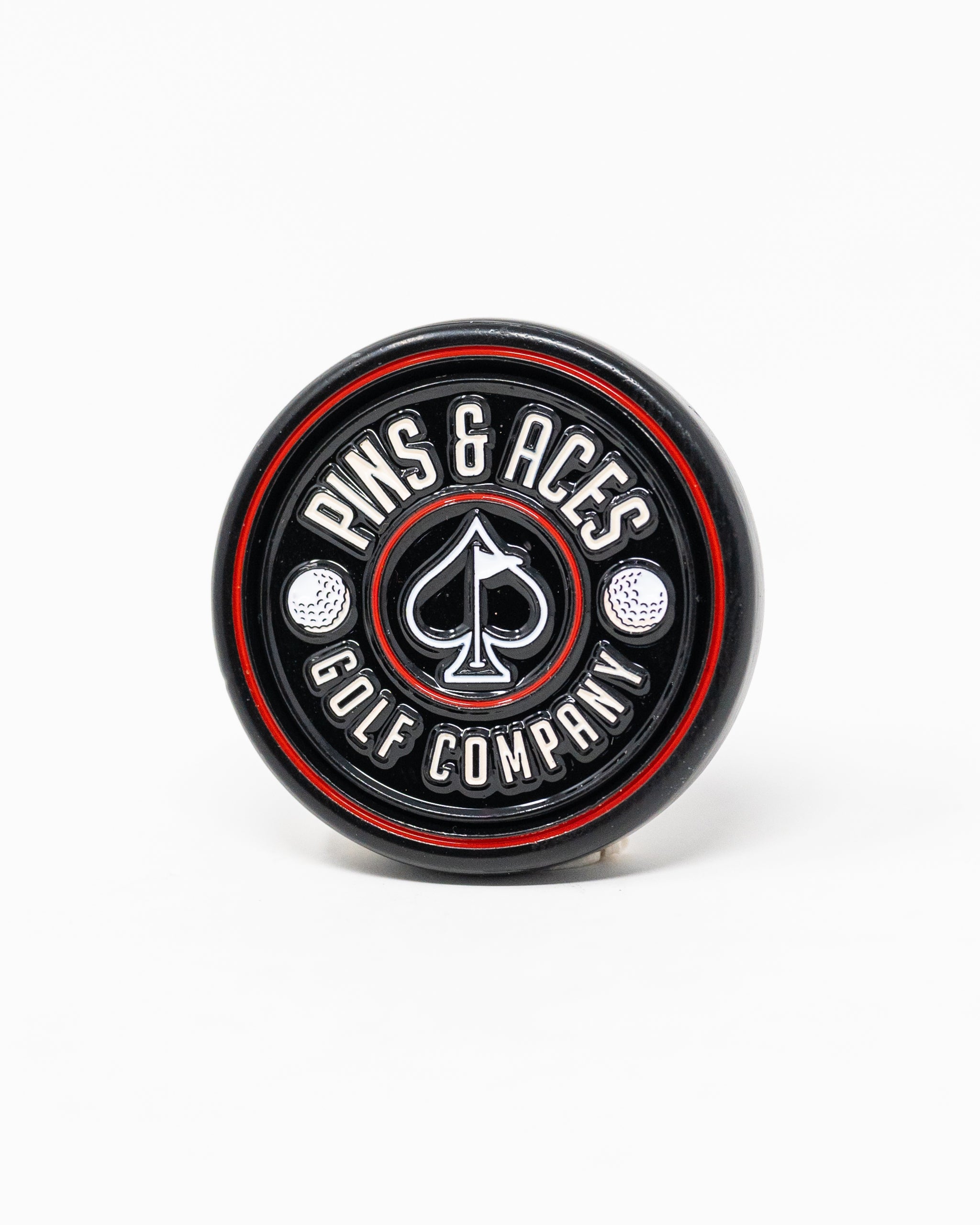 Black Pop Out Medallion Ball Marker, showcasing a sleek design and compact size for easy use on the golf course.
