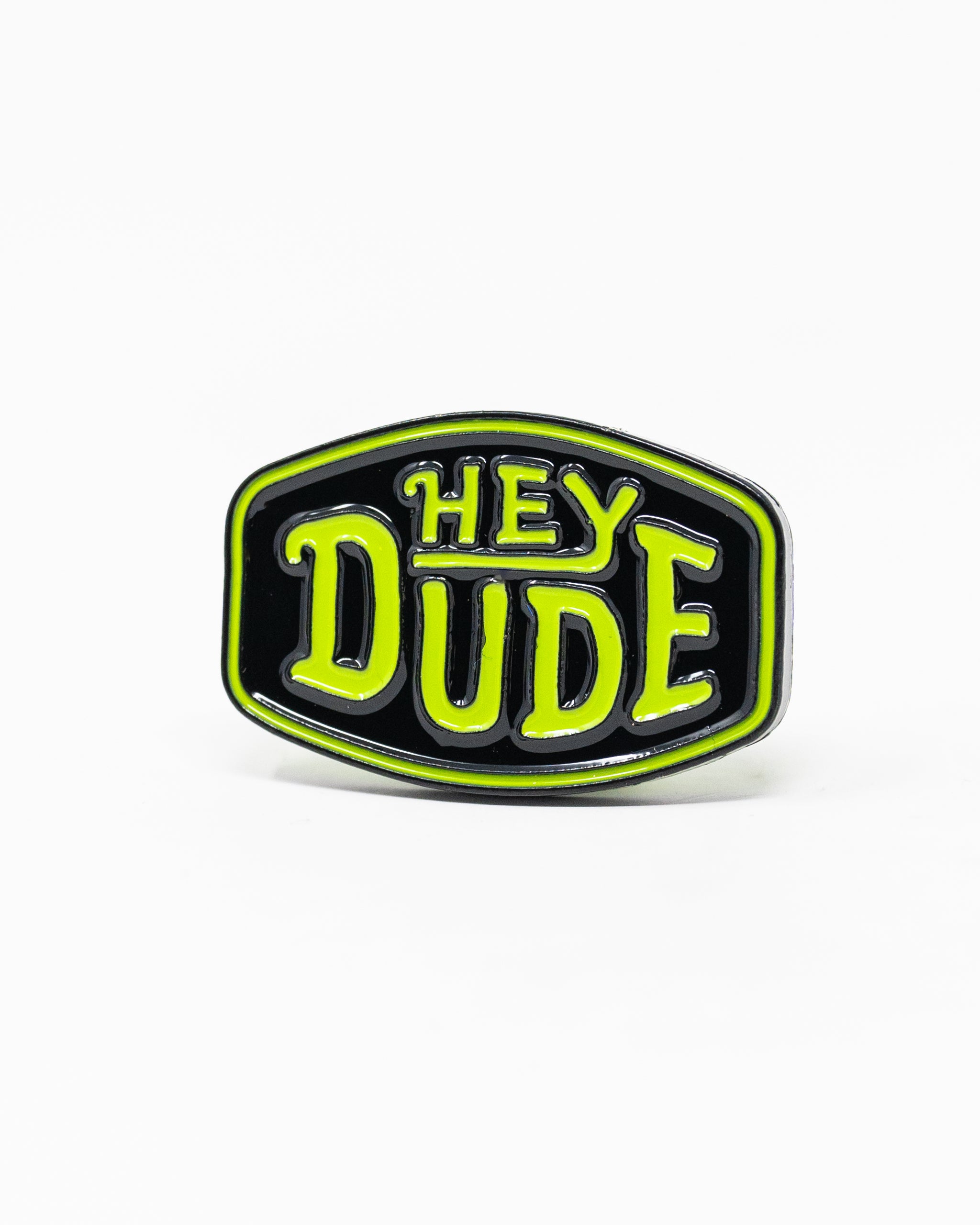 Alt text: HEYDUDE logo ball marker on a white background, showcasing a circular design with the brand’s logo prominently featured.