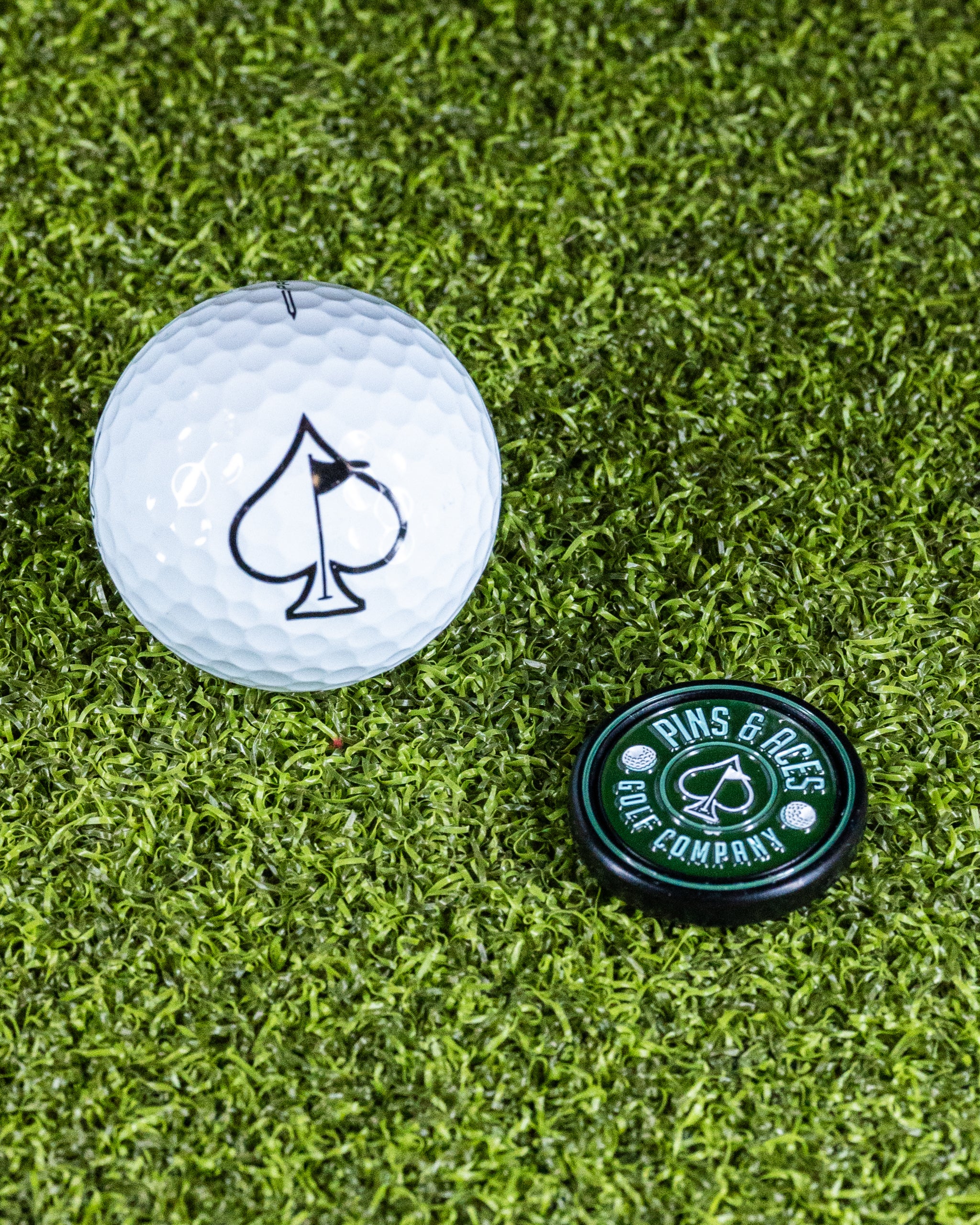 Green Pop Out Medallion Ball Marker on a white background, featuring a circular design with a raised logo in the center.