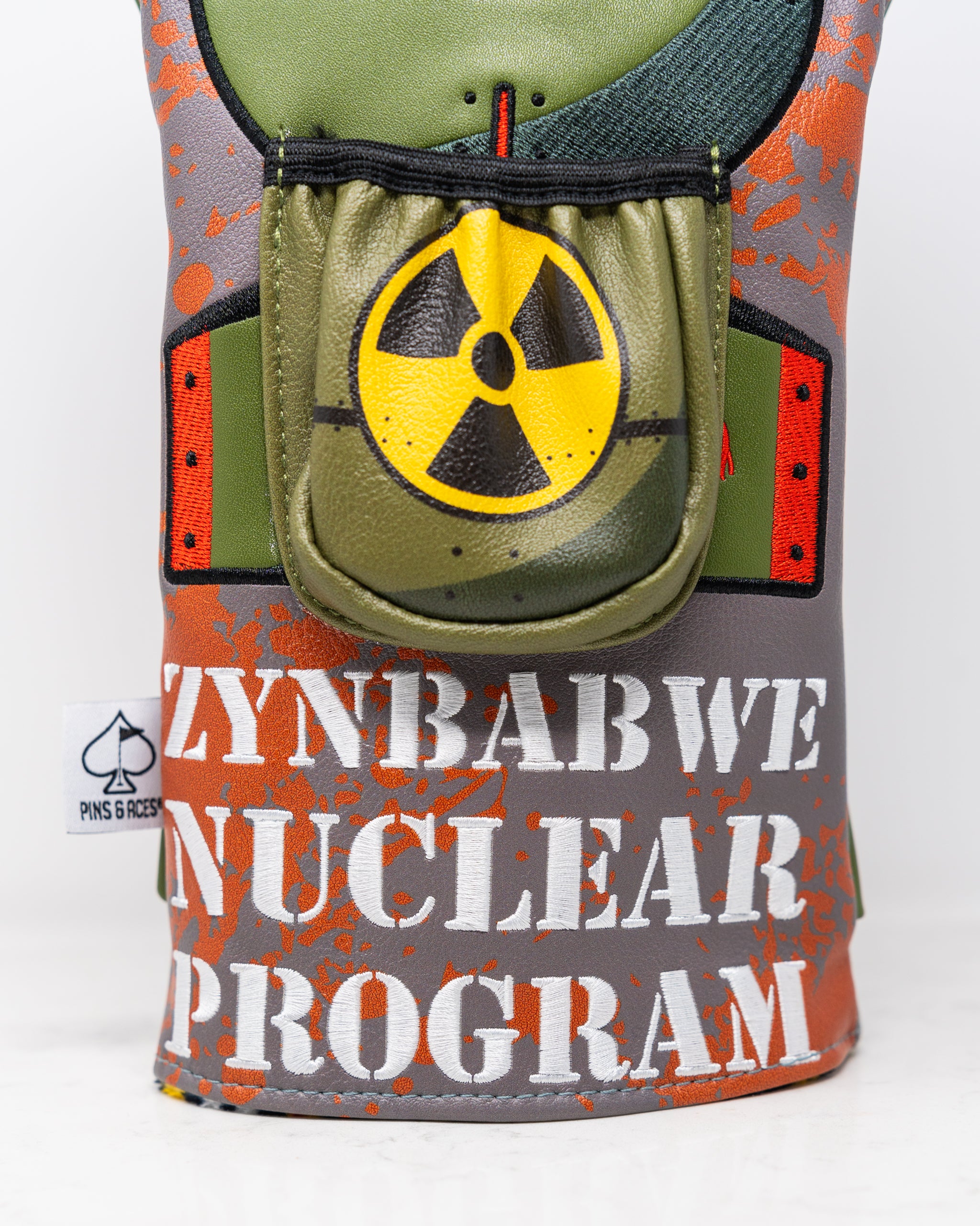"Zynbabwe Nuclear Program driver cover featuring a bold design inspired by nuclear themes."