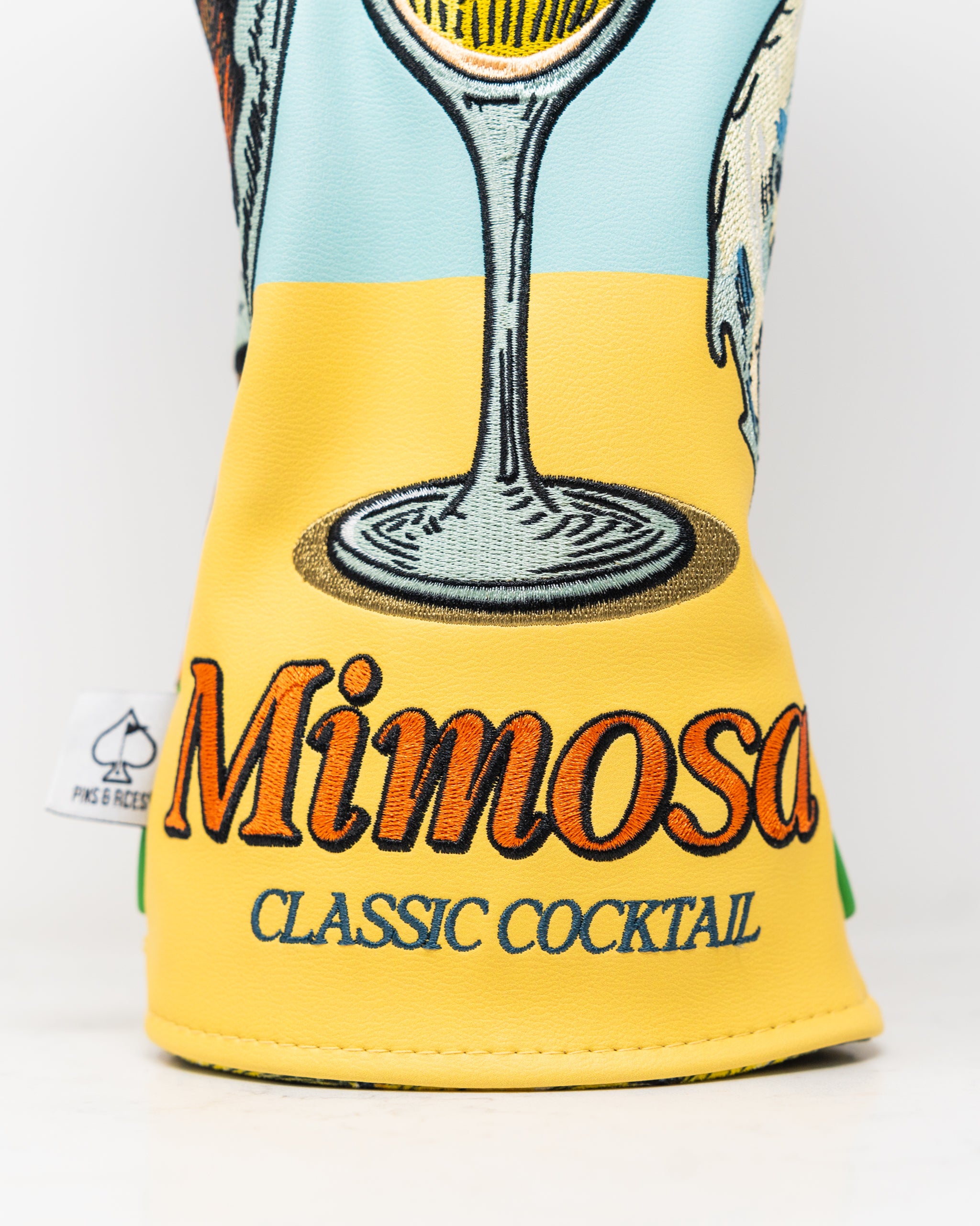 Mimosa driver cover featuring a vibrant floral design with a soft plush exterior.