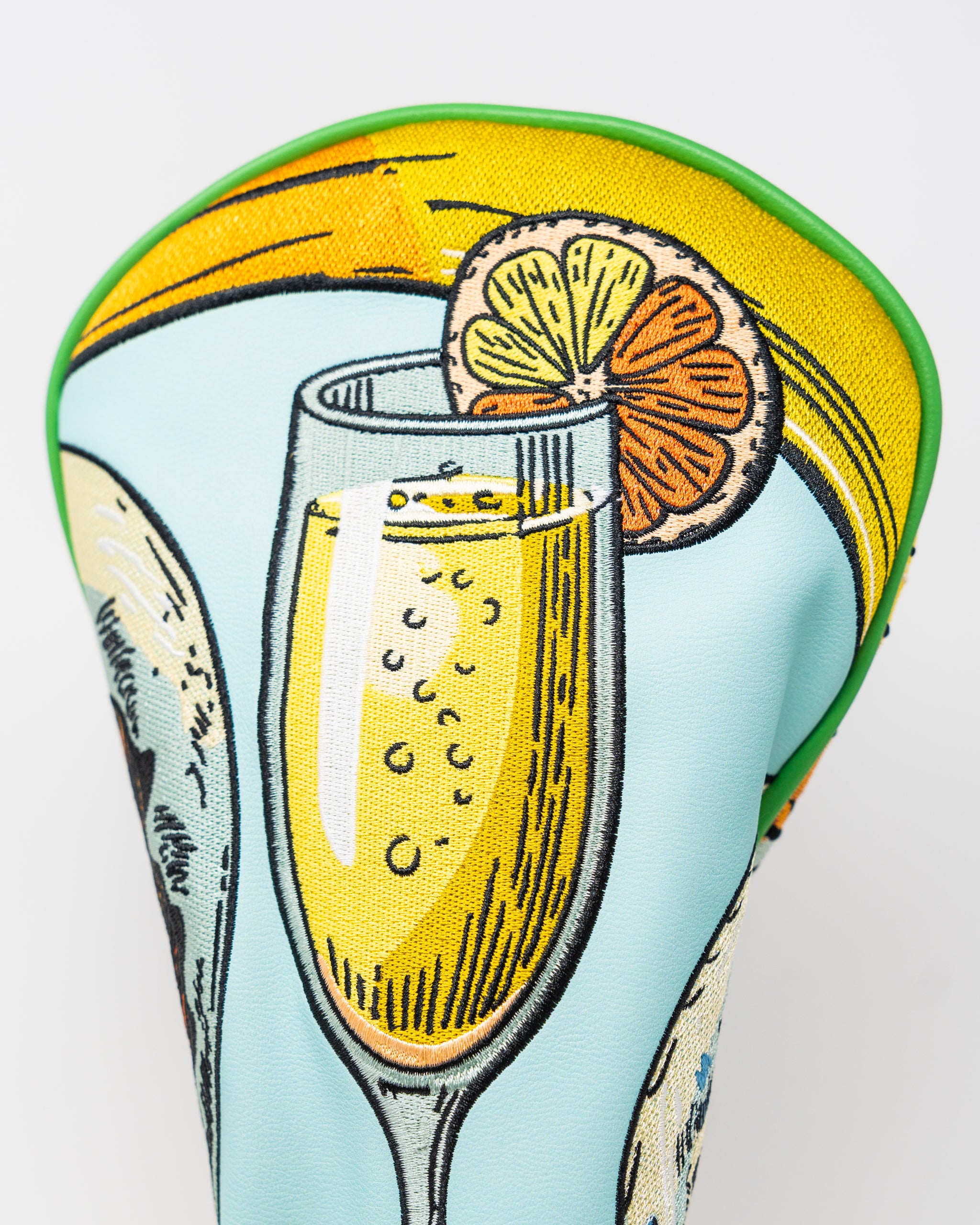 Mimosa driver cover with vibrant floral pattern on a sleek design.