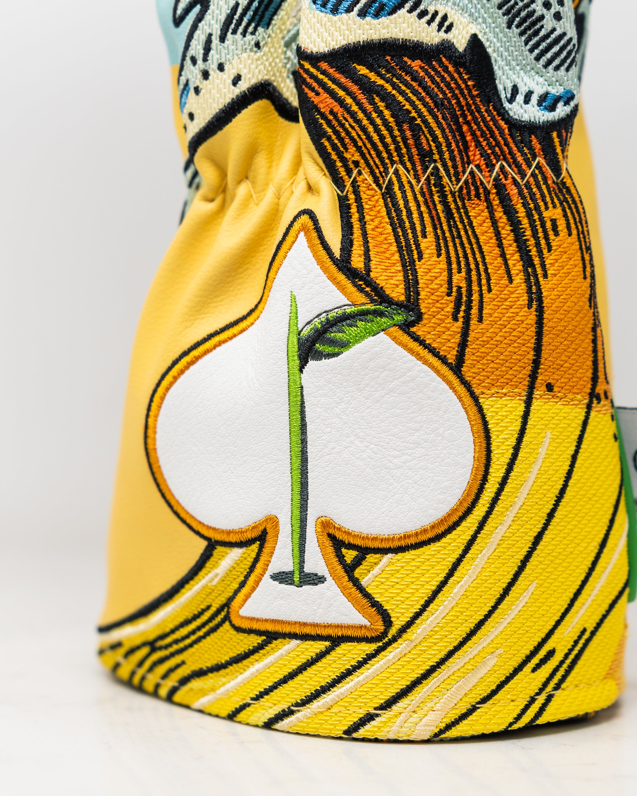 Mimosa Driver Cover featuring a colorful floral design with a vibrant orange and yellow color scheme, suitable for golf clubs.