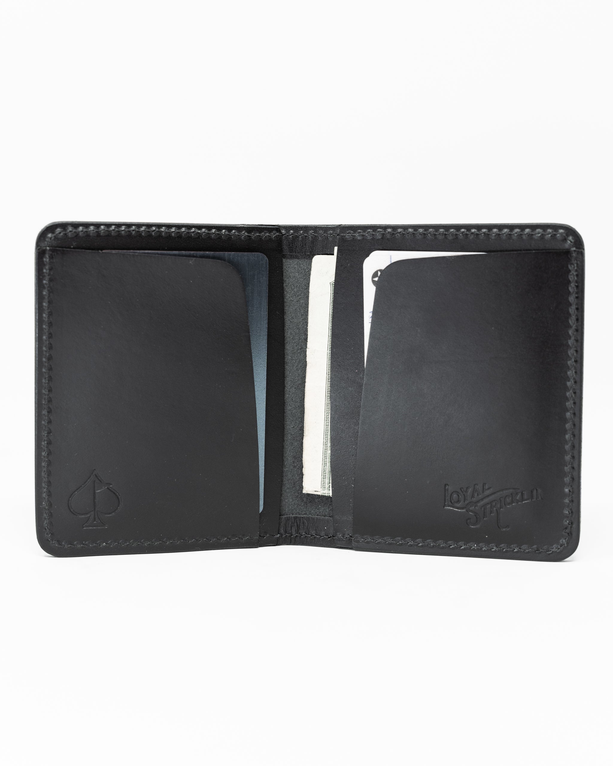 Miles Wallet in smooth Italian black leather, featuring a sleek design and minimalist styling on a neutral background.