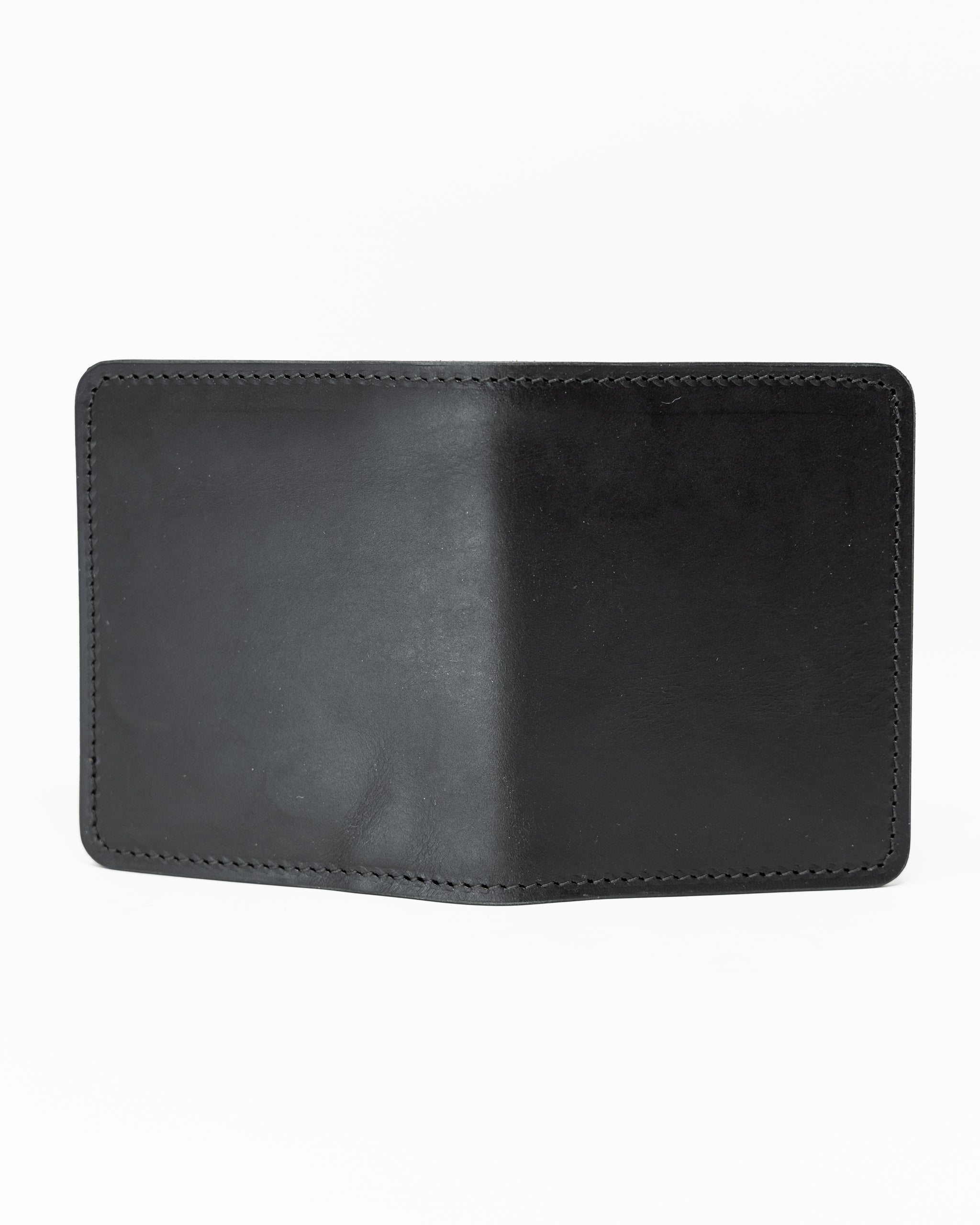 Miles Wallet in smooth black Italian leather, featuring a sleek design and minimalist aesthetic.