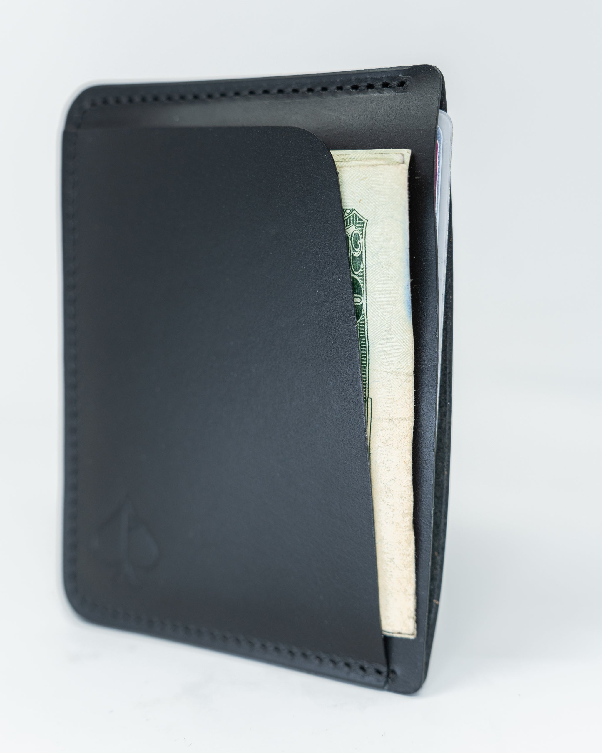 Frank Wallet in smooth Italian black leather, featuring a minimalist design with a sleek profile and multiple card slots.