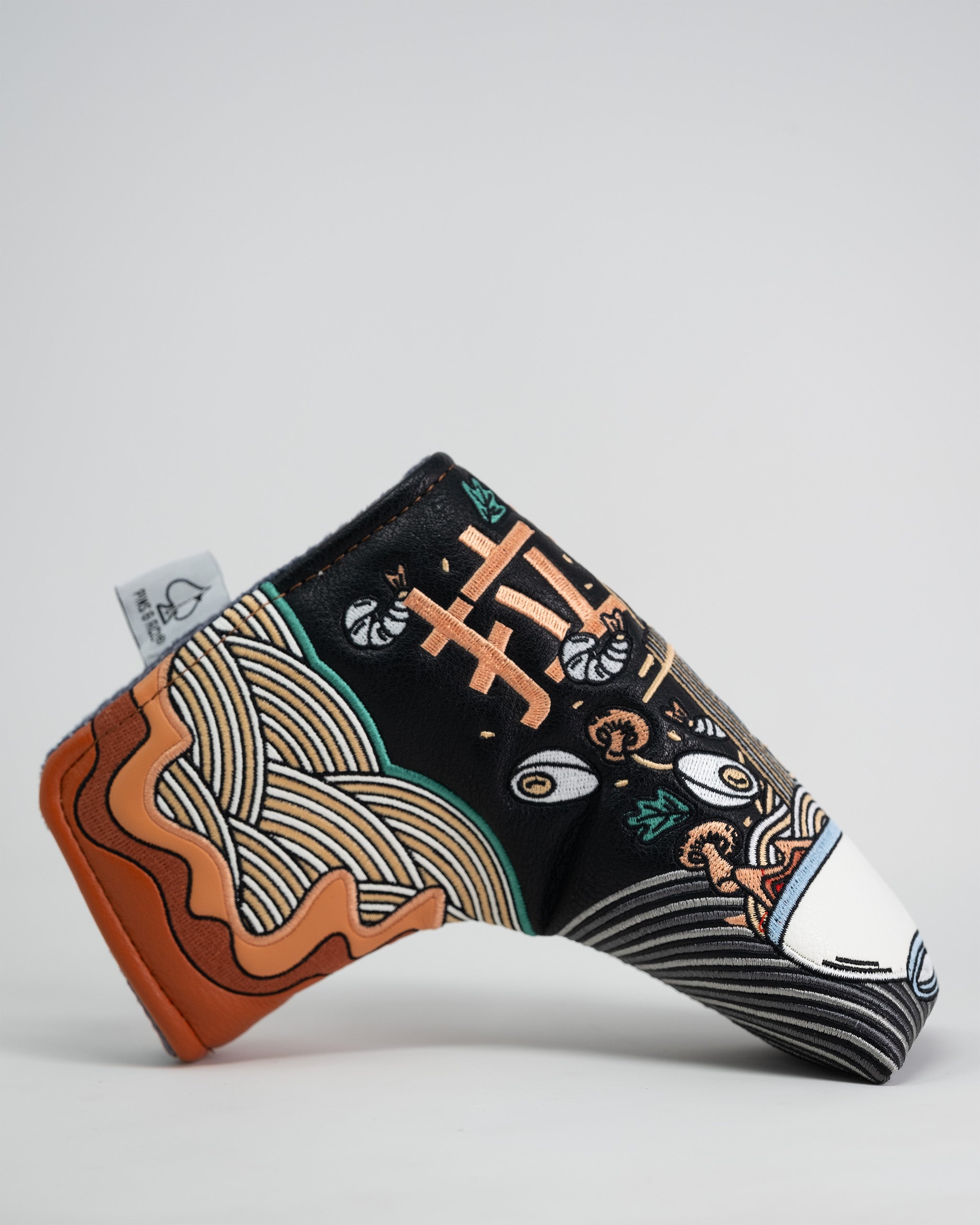 Ramen-themed Blade Putter Cover with colorful noodle and ingredient illustrations, designed to protect golf club blades.