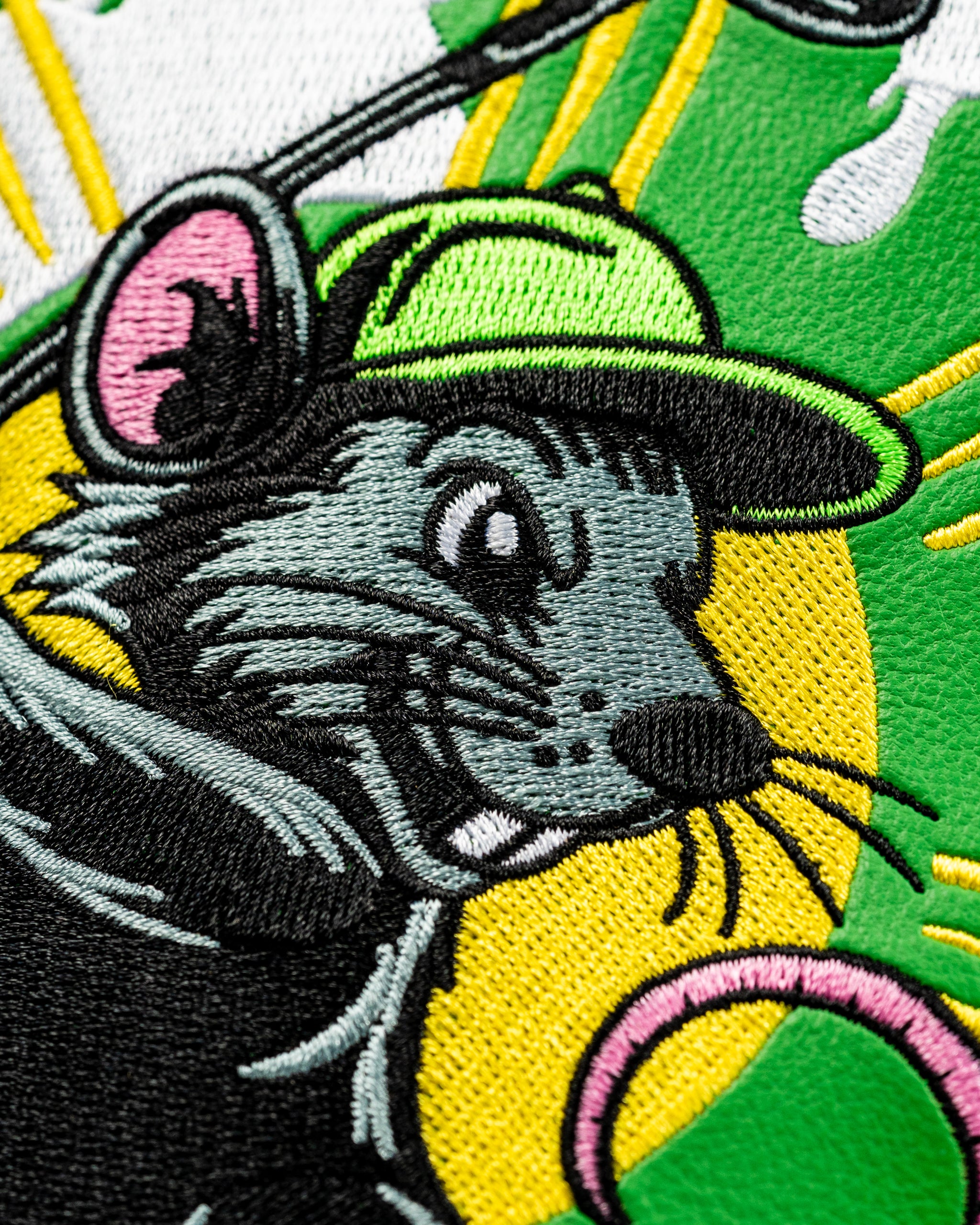 Colorful fairway cover featuring a playful embroidered rat wearing a green cap, perfect for adding fun to your golf game.