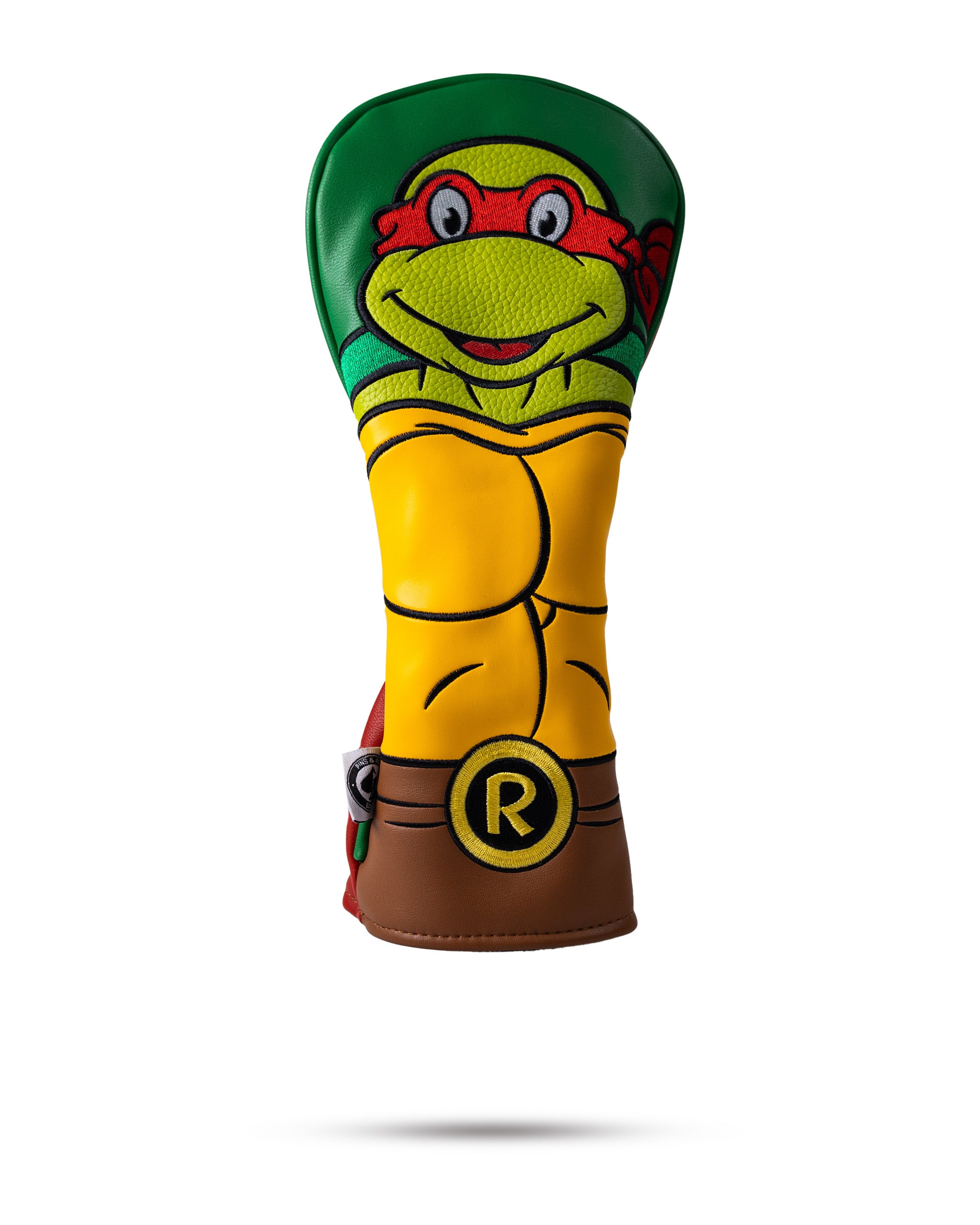 Colorful Teenage Mutant Ninja Turtle golf headcover with yellow, green, red, and brown, featuring a playful turtle design ...
