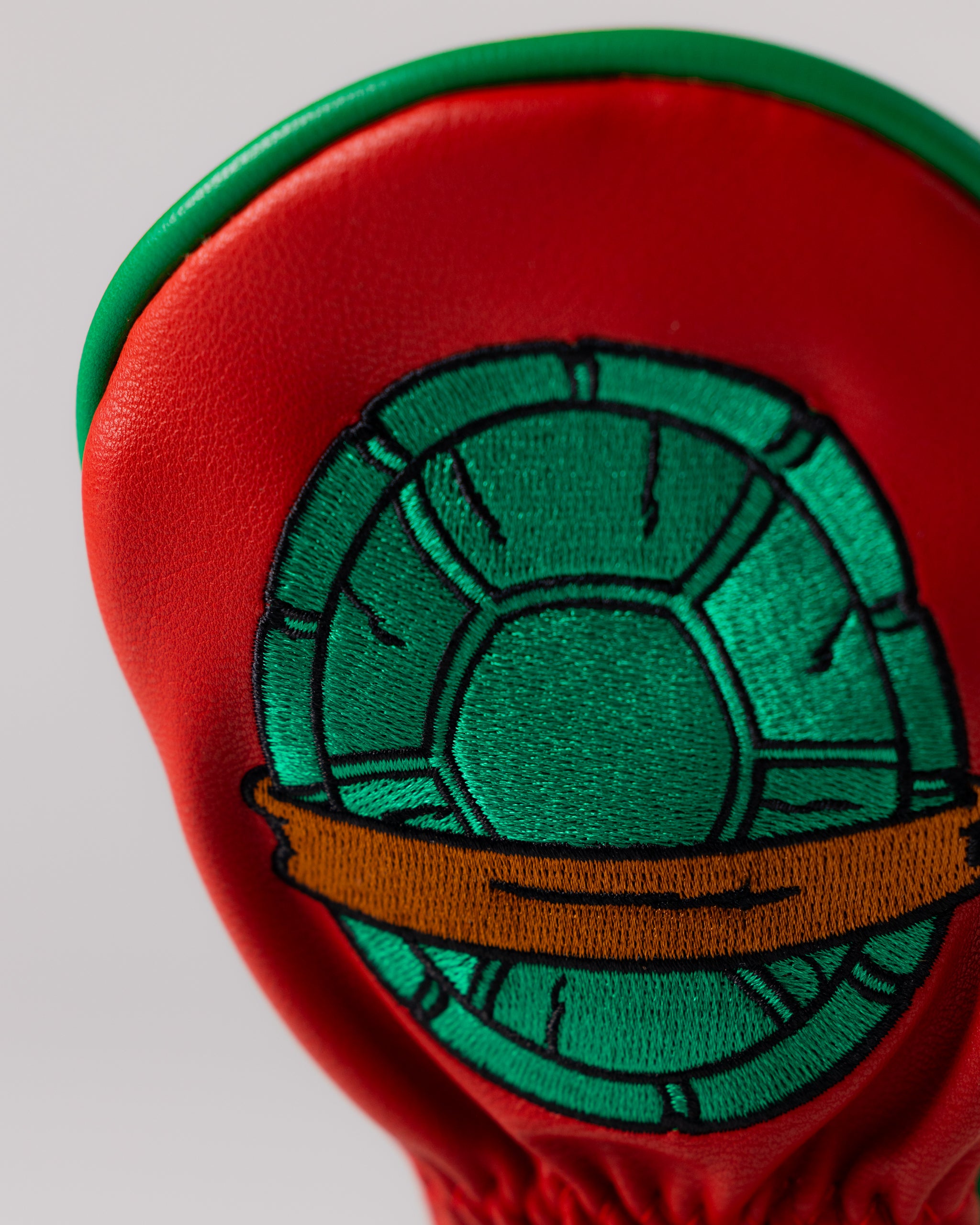 TMNT Raphael Hybrid Cover featuring a detailed illustration of Raphael, showcasing his iconic red mask and weapons against a vibrant background.