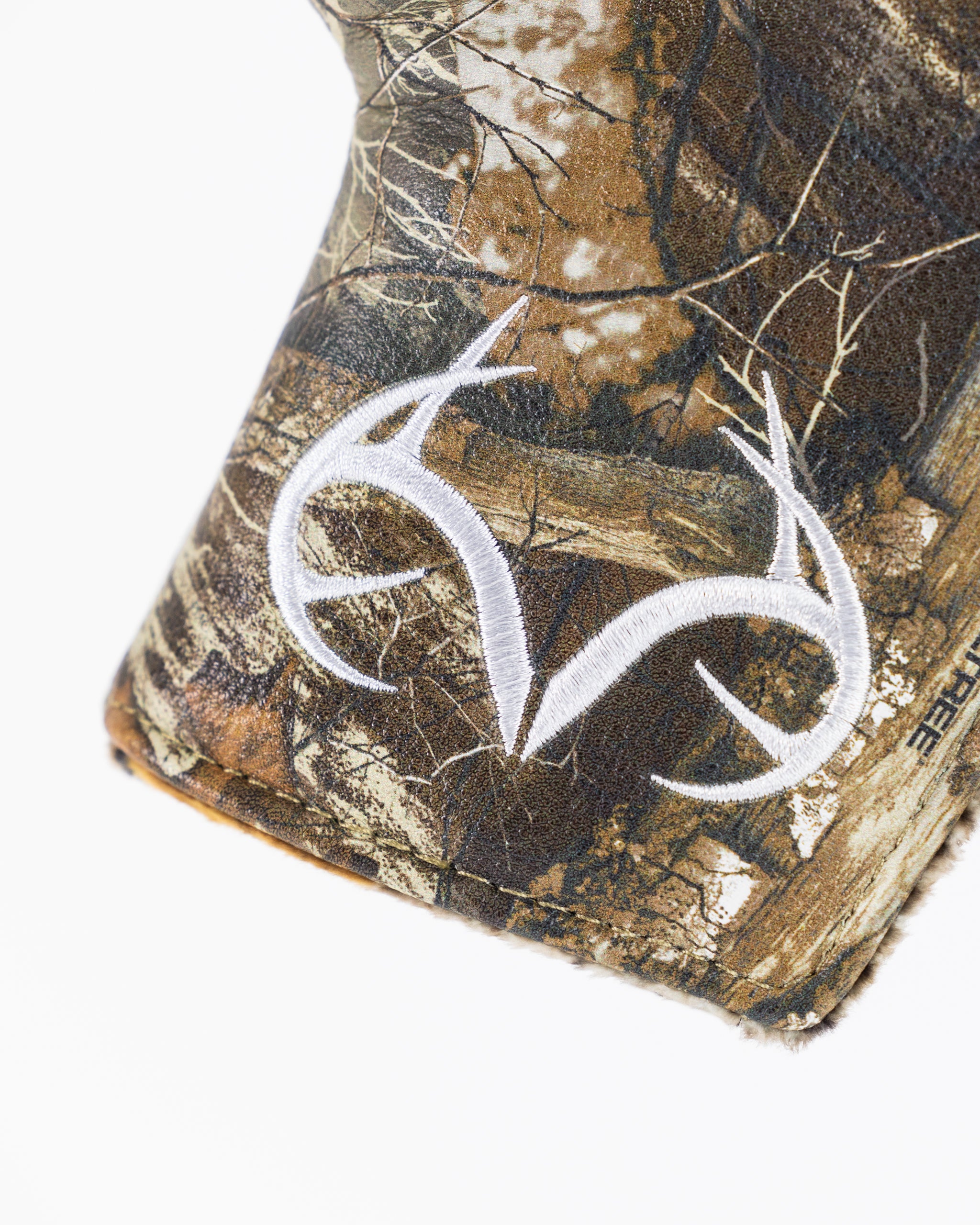 Realtree camo blade putter cover featuring a realistic woodland pattern for enhanced club protection.